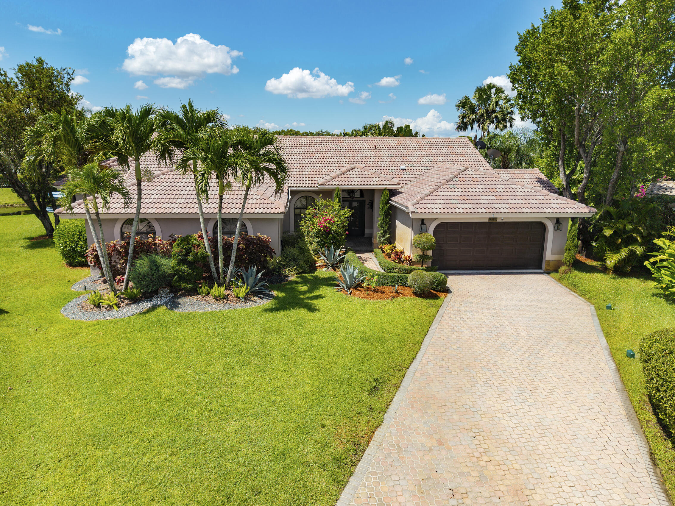 Amazing opportunity to purchase this 5 Bedroom, 3.5 Bathroom Waterfront Pool home on oversized cul-da-sac lot from these long term owners who have perfectly maintained this home & added some amazing custom features including a huge game-room with wet bar & wine/beverage cooler, huge addition to one of the guest rooms which makes the perfect office or gym. Features include: Full House Hurricane Protection including New Double Door Entry with Impact Doors, Vaulted Ceilings, the layout offers a split floor plan, separate living room, dining room & family room. Open Floor plan with Gorgeous Kitchen, Quartz Countertops & Stainless Steel Top of the line Appliances, Pantry w/ Pull Outs, Large Primary Bedroom with 2 Walk In Closets, Completely Renovated, Bathroom w/ Dual Sinks, Large Soaking Tub & Separate Walk In Shower, Very private yard with tons of landscaping & landscape lighting. This home shows very well and is one of a kind with these additions and great waterfront cul de sac lot, priced to fly.