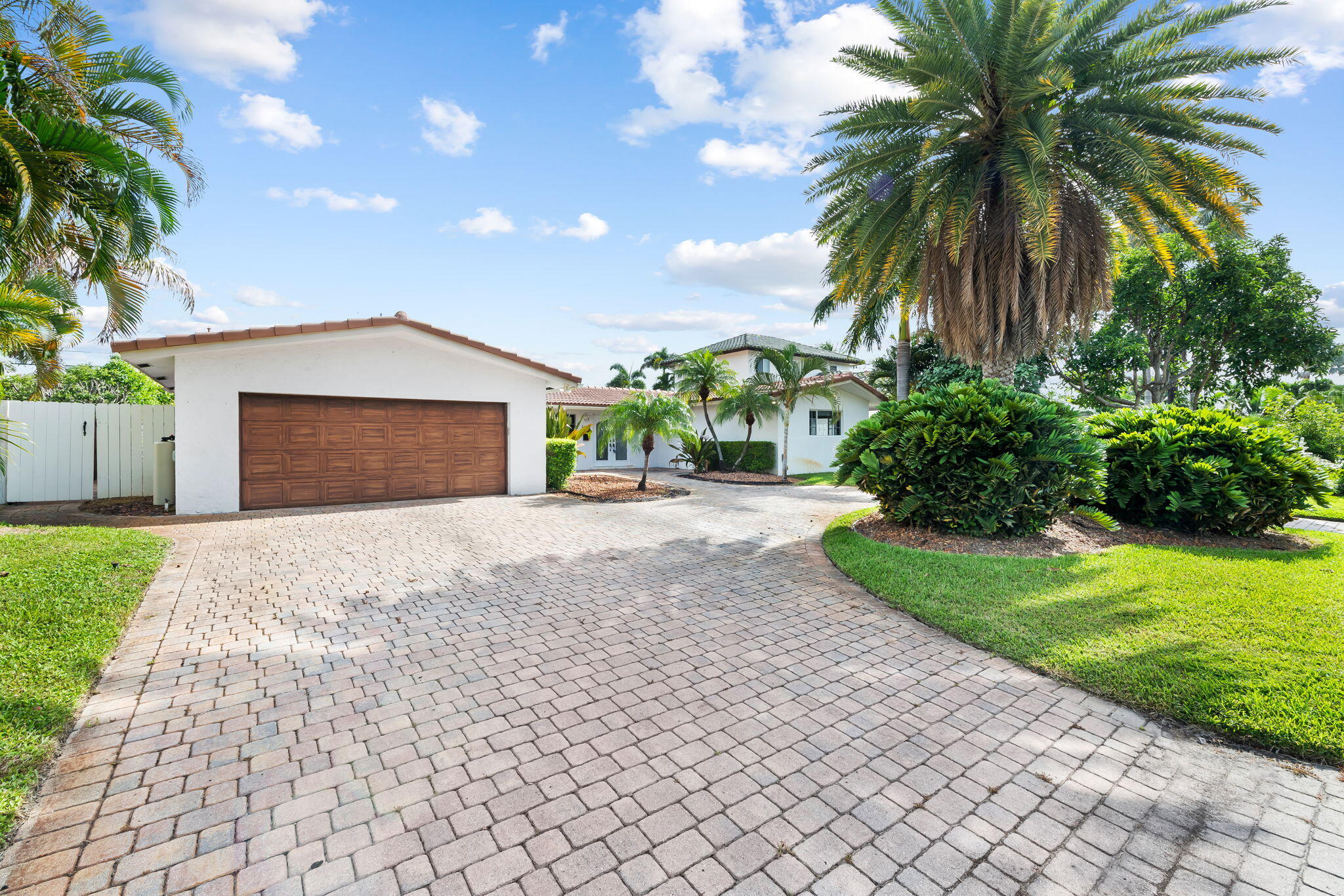 Welcome to one of Fort Lauderdale's most desirable neighborhoods! This single-story 3BR/2.5BA offers an open layout, granite counters, wood cabinetry, stainless appliances, a Sub-Zero fridge, and a breakfast bar. Travertine floors flow throughout the main living areas, with wood floors in the bedrooms. For extra cooling, the primary suite offers its own mini-split AC, opens to a sparkling pool and spa, an updated bathroom, and a guest suite with a private entrance, kitchenette, and mini-split AC, offering in-law or income potential. Includes a 2-car garage, circular paver driveway, and hurricane shutters. Sold AS-IS; the home needs a new roof and some TLC, priced accordingly at $790,000. A rare opportunity in one of Fort Lauderdale's best neighborhoods!