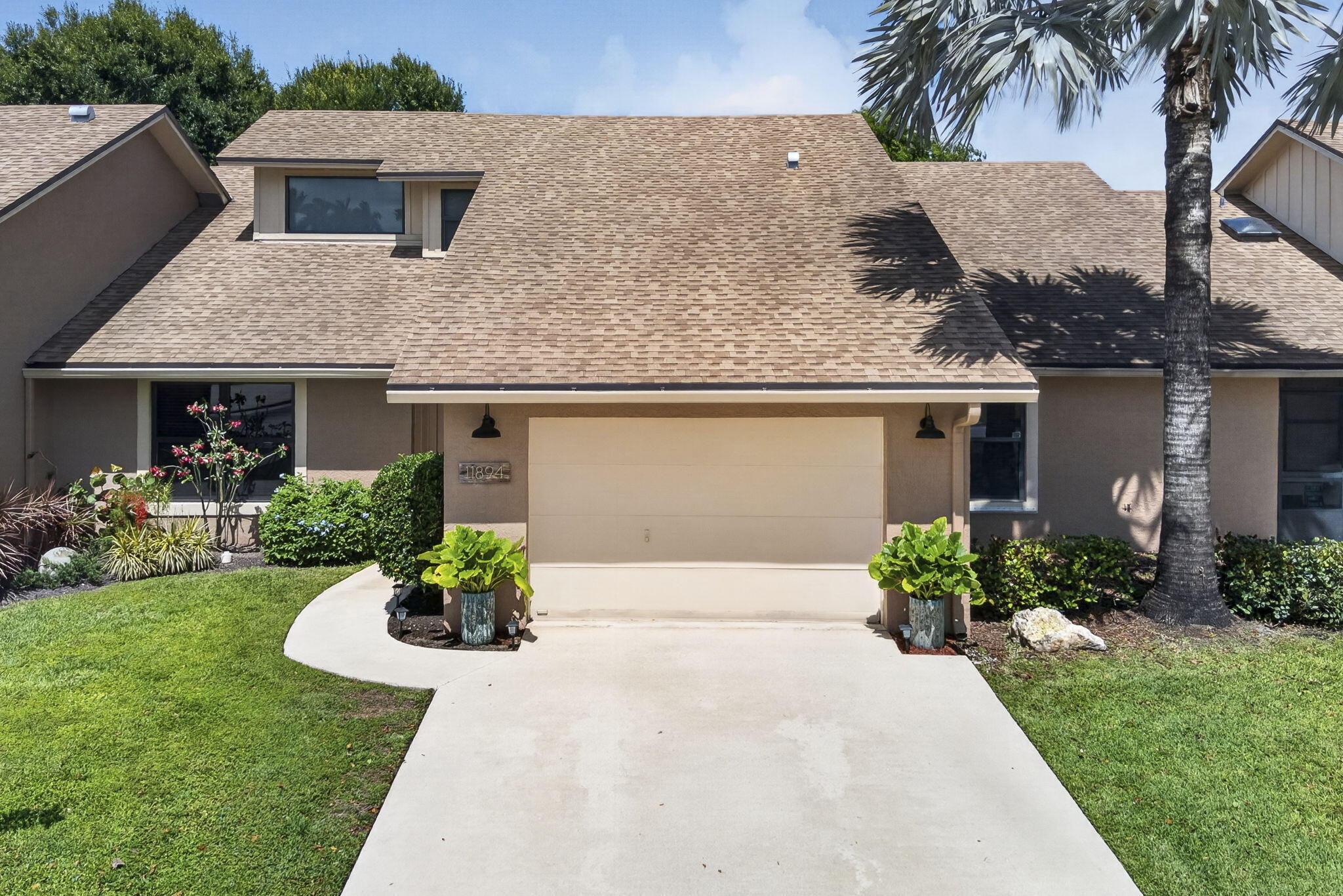 Welcome home to this exceptional residence in the highly sought after Park Place of Wellington, where a 2020 roof, impact windows, and beautiful updates throughout create the perfect blend of comfort, style, and peace of mind. Just minutes from Wellington International and the National Polo Center, and set in the heart of Wellington's renowned equestrian community, this beautifully remodeled residence also offers walking distance to the Wellington Amphitheater, where you can enjoy concerts, food truck events, art festivals, thrift sales, and more. Inside, you are welcomed by a stunning foyer with an artistic light fixture and elegant marble floors. Fresh light gray paint, 24 inch marble tile flooring, and vaulted ceilings create a bright, open, and sophisticated feel throughout the home.