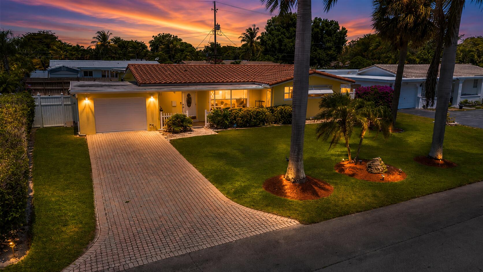 One of the best priced homes in the highly desirable Lighthouse Point community of Hillsboro Isles. This meticulously maintained 3-bedroom, 2-bath split floor plan offering 1,824 Sqft under air with a versatile studio/bonus space sits on an oversized 8,250 sq ft lot—a rare find. The open, sun-filled layout offers excellent flow for everyday living and entertaining. The property features a paver driveway, fully fenced backyard, and lush tropical landscaping with mature palms and vibrant lawn, plus room for a pool or hot tub. Ideally located minutes from the Lighthouse Point Marina, waterfront dining, shopping, parks, and beaches. A wonderful opportunity to enjoy space, privacy, and future potential in a sought-after coastal community.