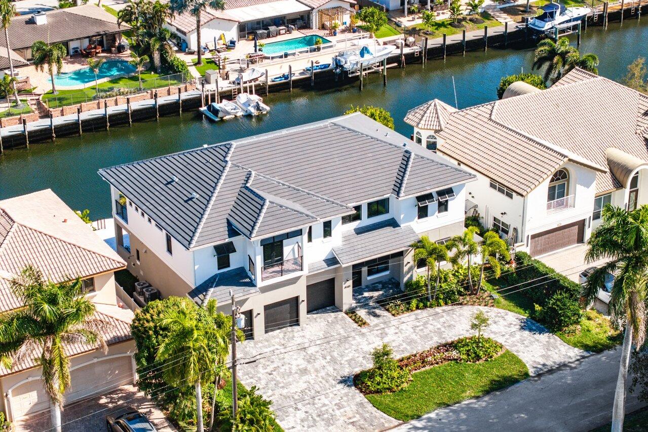 Presenting 4140 NE 23rd, a Coastal Contemporary waterfront masterpiece nestled in the charming seaside city of Lighthouse Point. Anticipated for completion by the end of spring 2024, this exquisite Waterfront Property boasts 85 feet of prime frontage and a wide to accommodate any size yacht.

Indulge in the allure of a phenomenal floor plan, featuring 6 elegantly appointed bedrooms, 6.1 full bathrooms, a captivating clubroom/movie room, and a guest bedroom on the first floor. The first floor seamlessly blends indoor and outdoor living with a full open concept, showcasing a kitchen with designer appliances, dining, and living room that extends parallel to the backyard. Massive sliders lead out to the backyard and summer kitchen, offering a picturesque view of the waterfront. The Primary bedroom welcomes you with an oversized suite and a private terrace, setting the stage for luxury living. The Primary Bathroom is a true sanctuary, featuring double vanities, an enclosed water closet, and a proprietary "wet room" with dual shower heads, rain shower, bench seating, and a 60-inch Free Standing Tub. Upstairs, discover an additional 4 bedrooms, each with ensuite bathrooms and walk-in closets.

Embrace resort-style living in both the front and backyard, combining timeless coastal aesthetics with modern amenities such as a 3-car garage, and a meticulously designed landscape.. The sun-kissed backyard, designed for relaxation and functionality, features highly coveted southeast exposure, a brand-new 85ft seawall and dock for your boat and water toys, and a covered patio leads to a stunning saltwater heated pool and spa overlooking the waterfront. 

Immerse yourself in the waterfront lifestyle within South Florida's prestigious boating community of Lighthouse Point. Perfectly situated, this home offers convenience with a 10-minute drive to Downtown Boca Raton, 15 minutes to Downtown Fort Lauderdale, 20 minutes to Fort Lauderdale's international Airport, and a notable 15-minute proximity to the Pompano Beach inlet leading to the Atlantic Ocean. Seize the opportunity to experience luxury living in this coastal haven!

Developers fee of 1.5% to apply. Disclaimer: The information published & provided including but not limited to prices, measurements, square footages, lot sizes, features, finishes, and calculations are subject to errors, omissions or changes without notice. All such information should be independently verified. All parties should perform their own due diligence on pre-construction sales to verify all information.