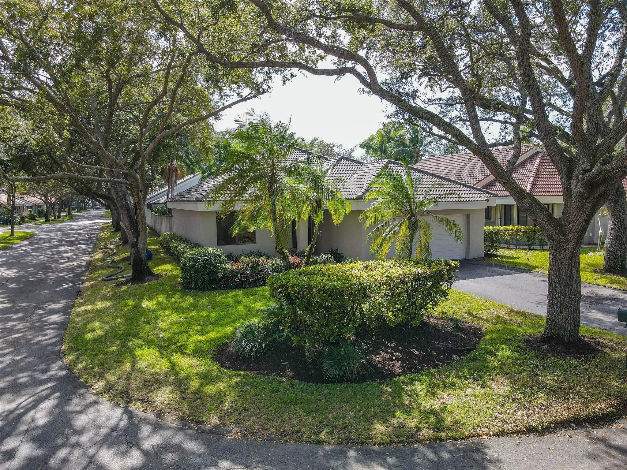 Beautiful Beech model perfectly situated on oversized corner cul-de-sac lot - total privacy & room for a pool. Step inside - Soaring ceilings & look out through the sliding doors with transom window to the spacious fenced backyard, natural light, an open comfortable layout, the den works great  as the 3rd bedroom or an office, Builders floor plan in photos. Split bedroom plan, Main suite - two walk-in closets, roman tub & separate stall shower. Updated kitchen - granite countertops and backsplash, stainless appliances & plenty of storage. Separate breakfast room off the kitchen. Inside laundry. Large brick paver patio ideal for gatherings. Impact garage door. Centrally located: To Major Highways, Plantation's Central Park & Volunteer Park, Sawgrass Mills Mall, Amerant Bank Arena.