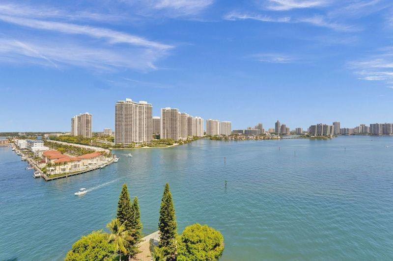 Million-dollar views without the million-dollar price tag. Low HOA, full amenities, and just minutes from the beach. High-floor corner unit with sweeping bay views, abundant natural light, and a spacious layout. Seize this rare gem in Sunny Isles Beach, where this condo's stunning bay views and layout at this price point are a Miami rarity. Ideal as a vacation home for or a year-round haven, it features an updated kitchen, floors, and bathrooms, all completed with permits. The smart split floor plan is a perfect blend for entertaining, a home office, or family living. 15 minute walk to pristine beaches and surrounded by multiple houses of worship! Located near Aventura Mall, Bal Harbour Shops and so much more.