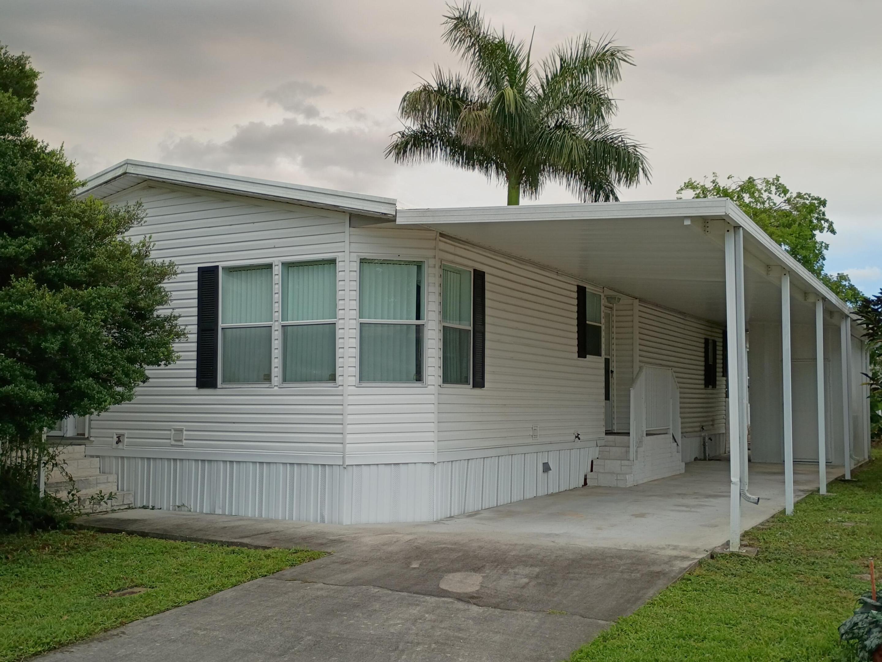 Welcome to this charming 2-bedroom, 2-bathroom mobile home situated in Park City Sec Two in Davie, Florida. Spanning 1,304 square feet of living space with high ceilings, lots of natural light, open kitchen, indoor laundry, covered carport with storage and a primary bedroom with access to an enclosed patio overlooking the water. This waterfront property location is just minutes to shopping, restaurants and easy access to highways. Located in the established Park City Over 55 community features pools and a variety of recreational activities.