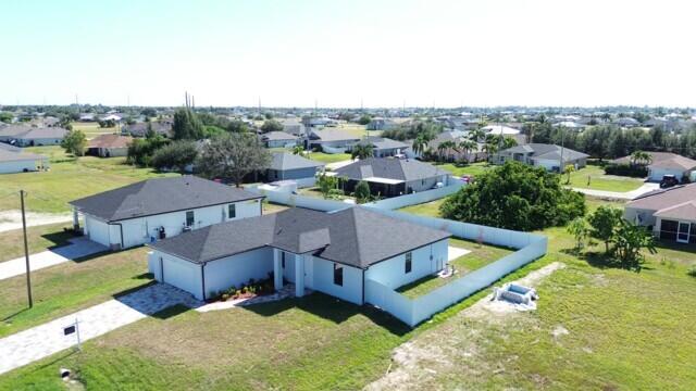 Spectacular 4 bedroom 2 bath, and two car garage, CBS NEW CONSTRUCTION Home is in a desirable neighborhood of Cape Coral. Plenty o living room space with High Ceilings and a marvelous Open Floor Plan Kitchen with upgraded large , with plenty of closet space and a large bathroom. All rooms are spacious and have excellent storage space. The Home's patio features a pool and a large backyard. Open concept design is perfect for entertaining and creating lasting memories with your loved ones. The kitchen is a chef's dream, with modern stainless steel appliances, beautiful countertops .