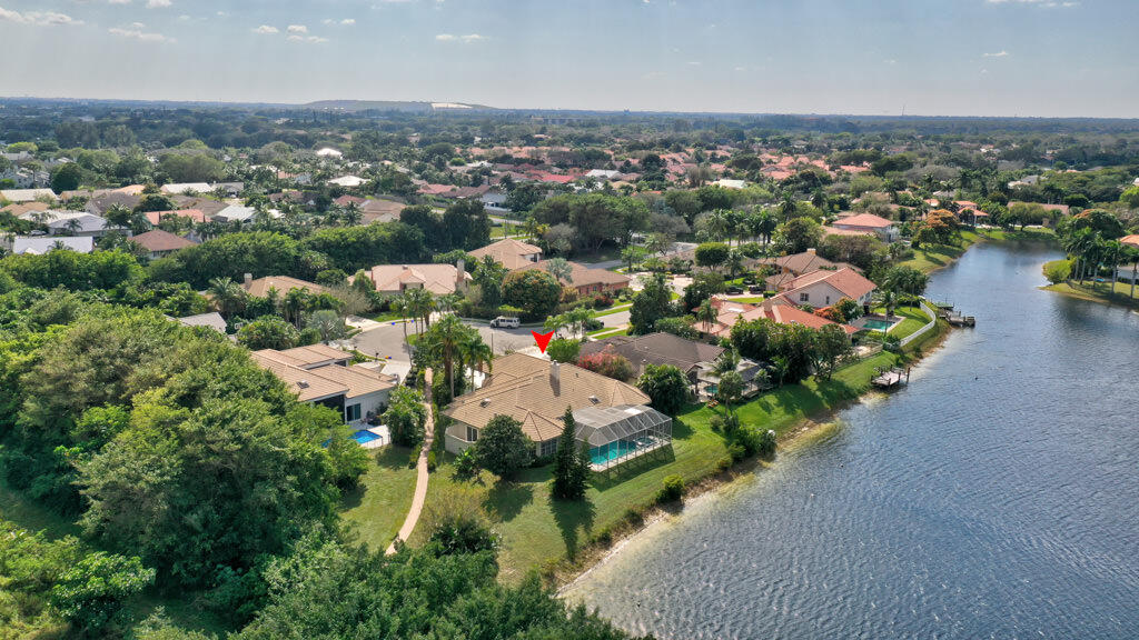 This beautiful home is in the picturesque, gated community of Sailing and Racquet Club in Boca Raton.  The property sits on a gorgeous lake on a Cul-de-Sac. It only has one neighbor.  The community offers tennis courts, sailing, kayaking, canoeing, paddle boarding, biking, fishing, walking, jogging... This  area has top rated schools. Close to the beach and  just few minutes away from Town Center and Mizner Park for shopping, Dining and entertainment.