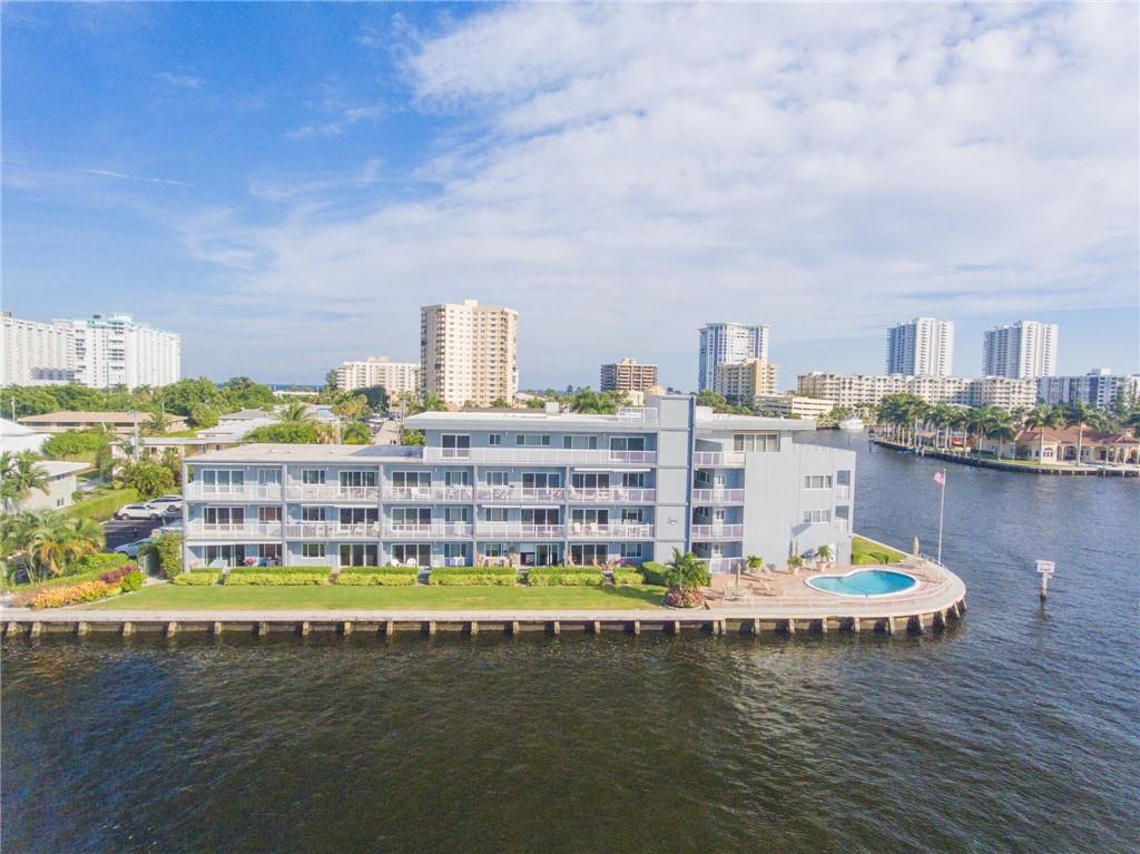 Relax and enjoy the South Florida lifestyle in this updated unit situated directly on the Intracoastal and Lake Santa Barbara. The views are amazing and there is a constant parade of boats on display for your enjoyment. The unit also features impact windows and doors, updated bathroom, expanded eat-in kitchen and a spacious living room. The kitchen features stylish granite counter tops, white cabinetry. The open balcony boasts spectacular views. Conveniently located close to the golden sand beaches, countless dining options, shopping and nightlife. Great value for Intracoastal front living.