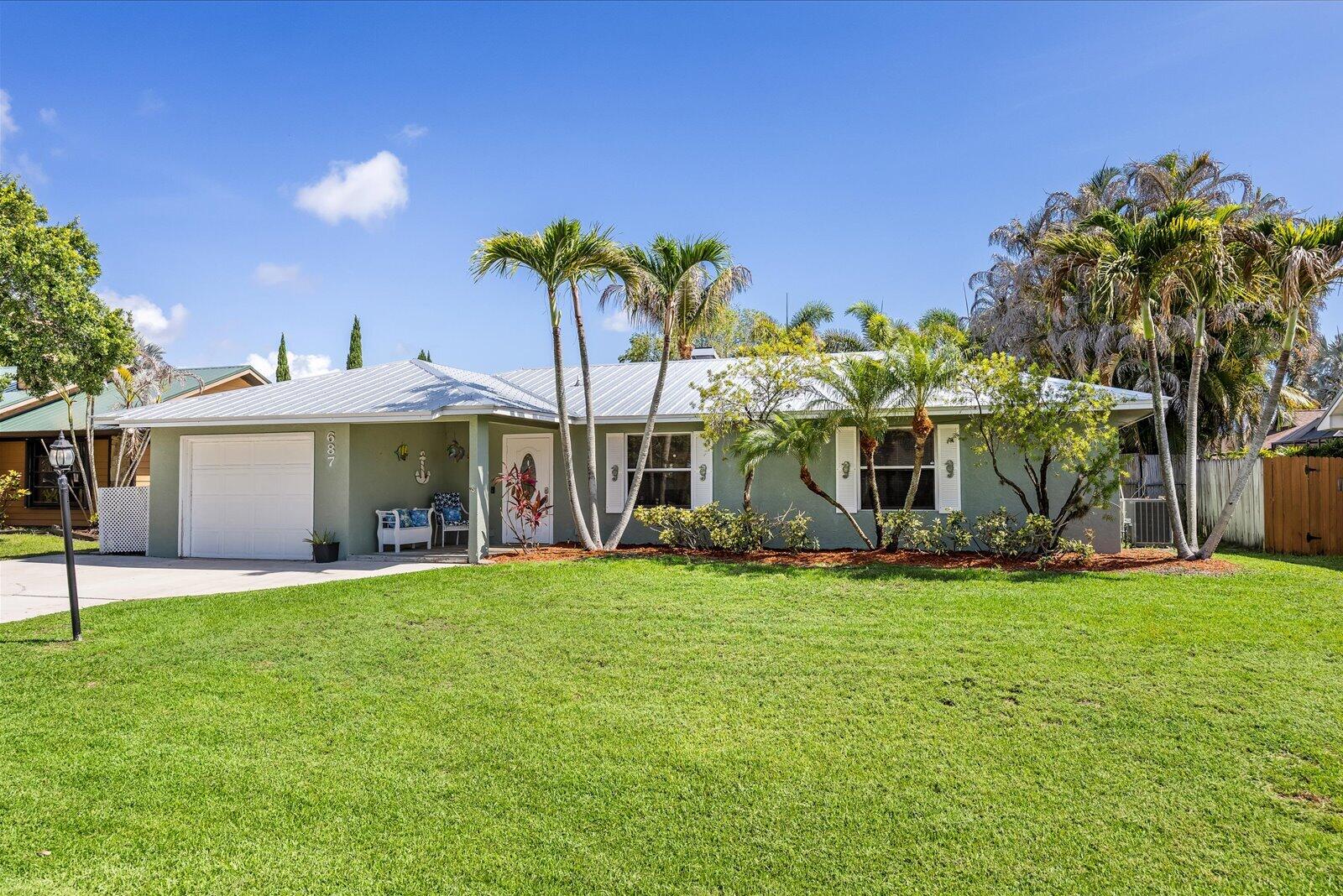 Welcome to this charming rental home in the desirable Jensen Park Estates community! This well-maintained residence offers comfortable Florida living with a private fenced backyard perfect for relaxing or entertaining. Enjoy the tropical pool and covered porch, creating your own private outdoor oasis. Conveniently located just minutes from downtown Jensen Beach, where you'll find popular dining, shopping, and entertainment options. The home is close to top-rated Martin County schools and just 10 minutes from the beautiful Treasure Coast beaches. Truck-friendly and small boat/trailer-friendly, this property offers flexibility that is hard to find. One dog up to 30 pounds will be considered. FULL lawn maintenance and pool maintenance are included in the lease!