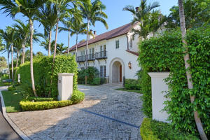 Exceptional Value. Tuscan 2 story villa built around spacious private courtyard. Beautifully designed, built & maintained. Large lot (18,479 SF). Some lake views. 6 Bedrooms, 6 Full Baths, 2 Half Baths with Library, Family Room, Eat-in Kitchen, 3 Car Garage, Pool/Spa, outdoor fireplace and separate Guest House.