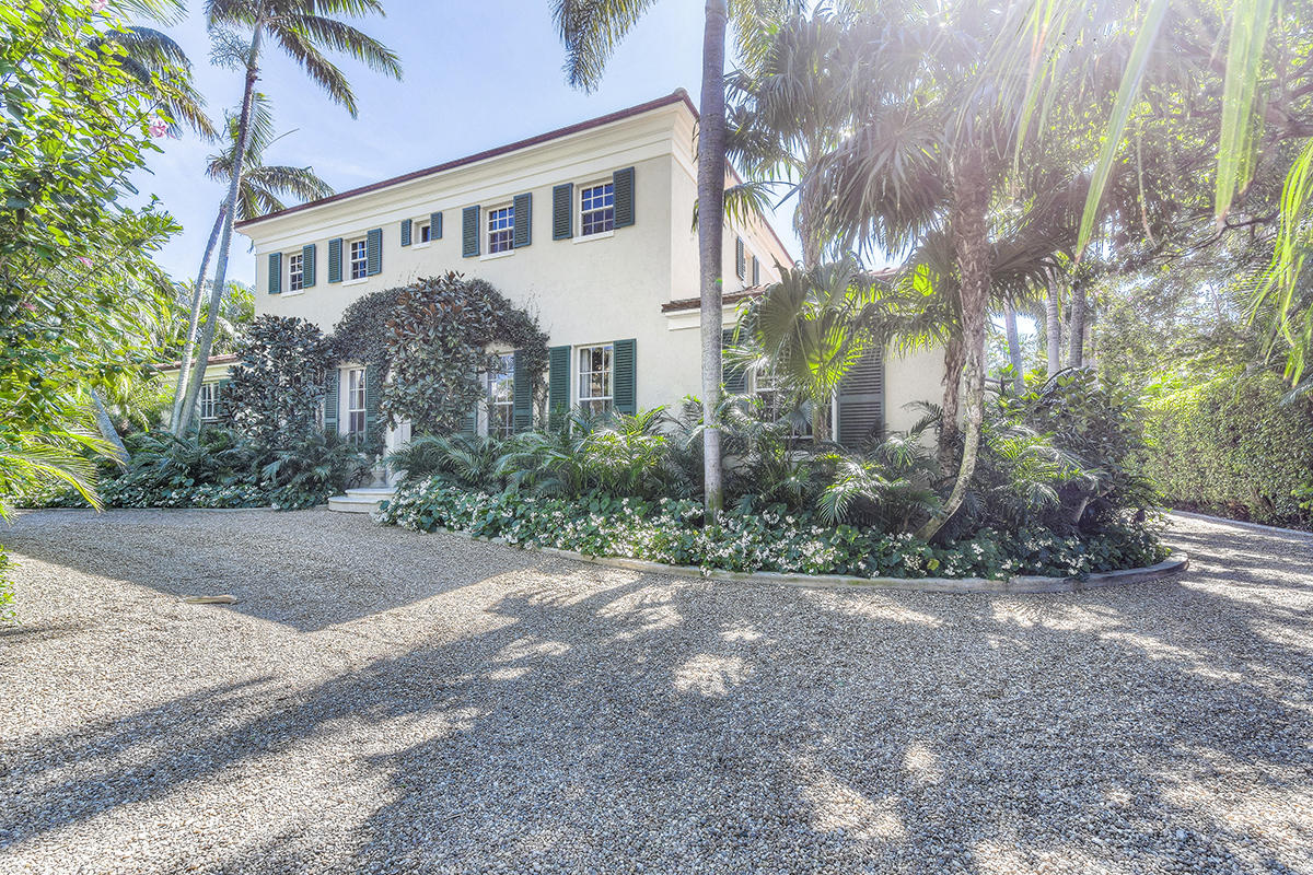 Pristine Palm Beach. This tranquil retreat, located in the secluded North End of world-famous Palm Beach Island, is surrounded by mature landscaping. The ornate arched entryway of this two story home leads to the gracious gallery foyer with beautiful arched columns. Pristine terracotta tile flows throughout most of the main floor living spaces. Flooded with natural light, the spacious living room overlooks the pool and leads through three sets of French doors to the patio and backyard. A gourmet kitchen features a gas range and stainless appliances. The downstairs is completed by a guest suite and large laundry room. Upstairs, a stunning master suite with a beautiful balcony covered with bougainvillea overlooks the supremely tranquil backyard and pool. Two additional bedrooms offer plenty of room for friends and family. The North End of Palm Beach is surrounded by world-famous beaches on one side and the beautiful Intracoastal waterway on the other with easy access to both.