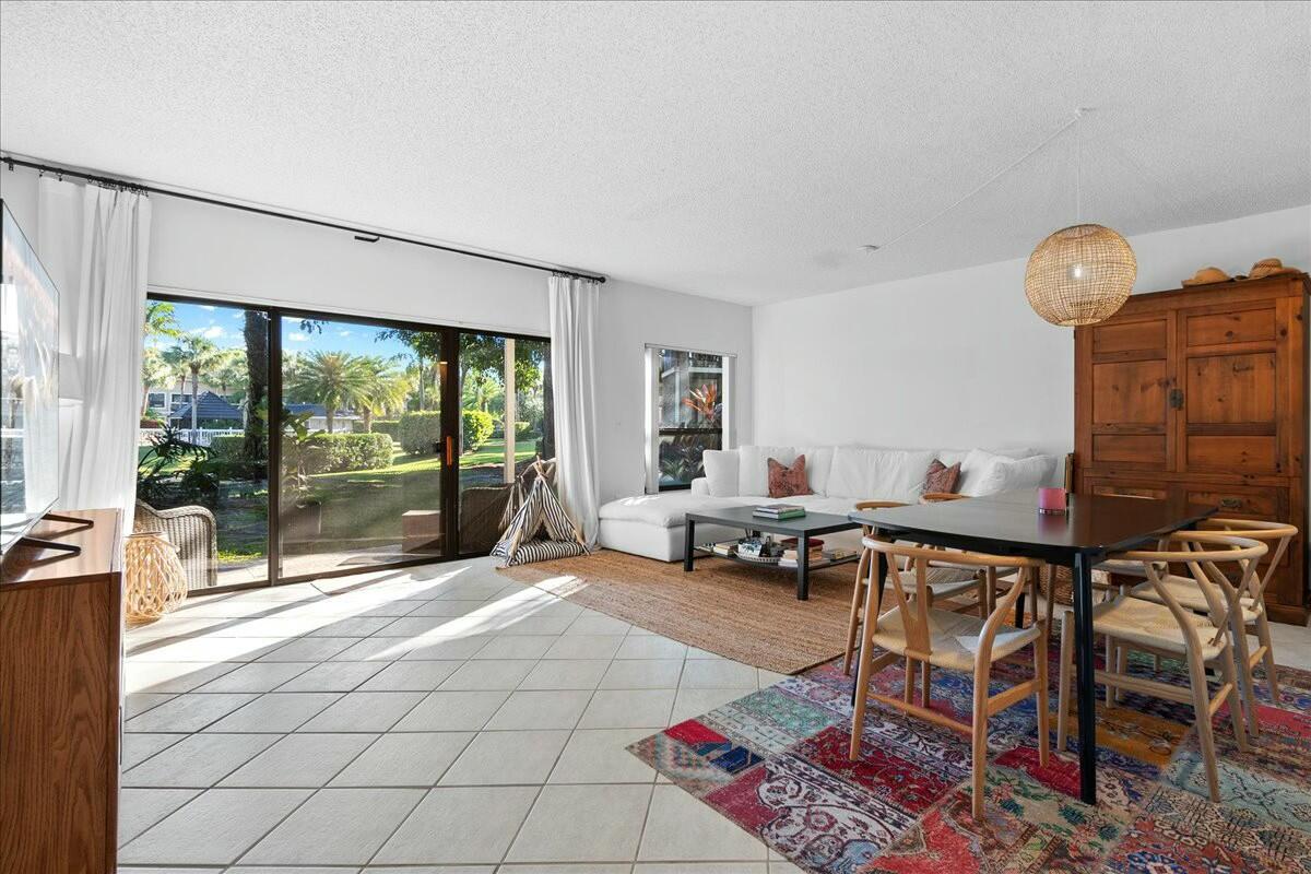 Charming Dual-Income Condo in Palm Beach Polo Club's Tennis Lodges.

Nestled in the desirable Tennis Lodges community within the prestigious Palm Beach Polo Club, this immaculate first-floor condo offers a rare opportunity for both comfort and flexibility. The 2-bedroom, 2-bath layout is uniquely configured as a 1-bedroom/1-bath unit alongside a separate studio—perfect for dual rental income or combined use.

Ideally situated in the interior of the community, this unit boasts serene views of a fountained pond and nearby pool. Convenience is key, with guest parking directly across from the front doors and mailboxes just steps away.

Inside, the 1-bedroom unit features an updated kitchen with natural stone countertops and crisp white cabinetry. The studio is fully equipped with its own kitchen, including a medium-sized refrigerator, making it fully functional for guests or tenants.

All major appliances have been recently updated, including both A/C units and in-unit washer & dryers, ensuring a hassle-free ownership experience. Both units have a strong rental history, having been successfully rented each season since purchase.

Whether you're seeking a smart investment, a winter getaway, or a year-round home, this condo offers the perfect blend of luxury, convenience, and income potential.

Experience the best of Country Club living. Schedule your showing today!