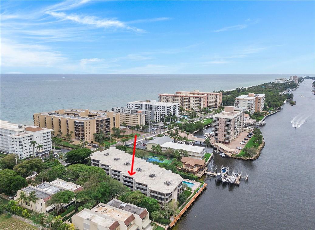 Spacious 2 story condo on Hillsboro Mile has 3 bedrooms, 3.5 bathroom, kitchen opens to a very large main living area. Use staircase or private elevator to access your 2 story home.  Situated right on the Intracoastal w/ stunning water views & deeded ocean access across the street. This exclusive residence has 2 indoor garage spaces, laundry room & plenty of storage.  Harborside is a luxury boutique building w/ only 18 units.  All renovations are paid. Accordion shutters. Short trip to Deerfield Pier, Pompano & Boca  - near endless beaches & minutes from restaurants & entertainment. Can be rented right away.  Association dock for boat pickup & drop off only. Pets under 20lbs allowed. Reduced and priced to sell!