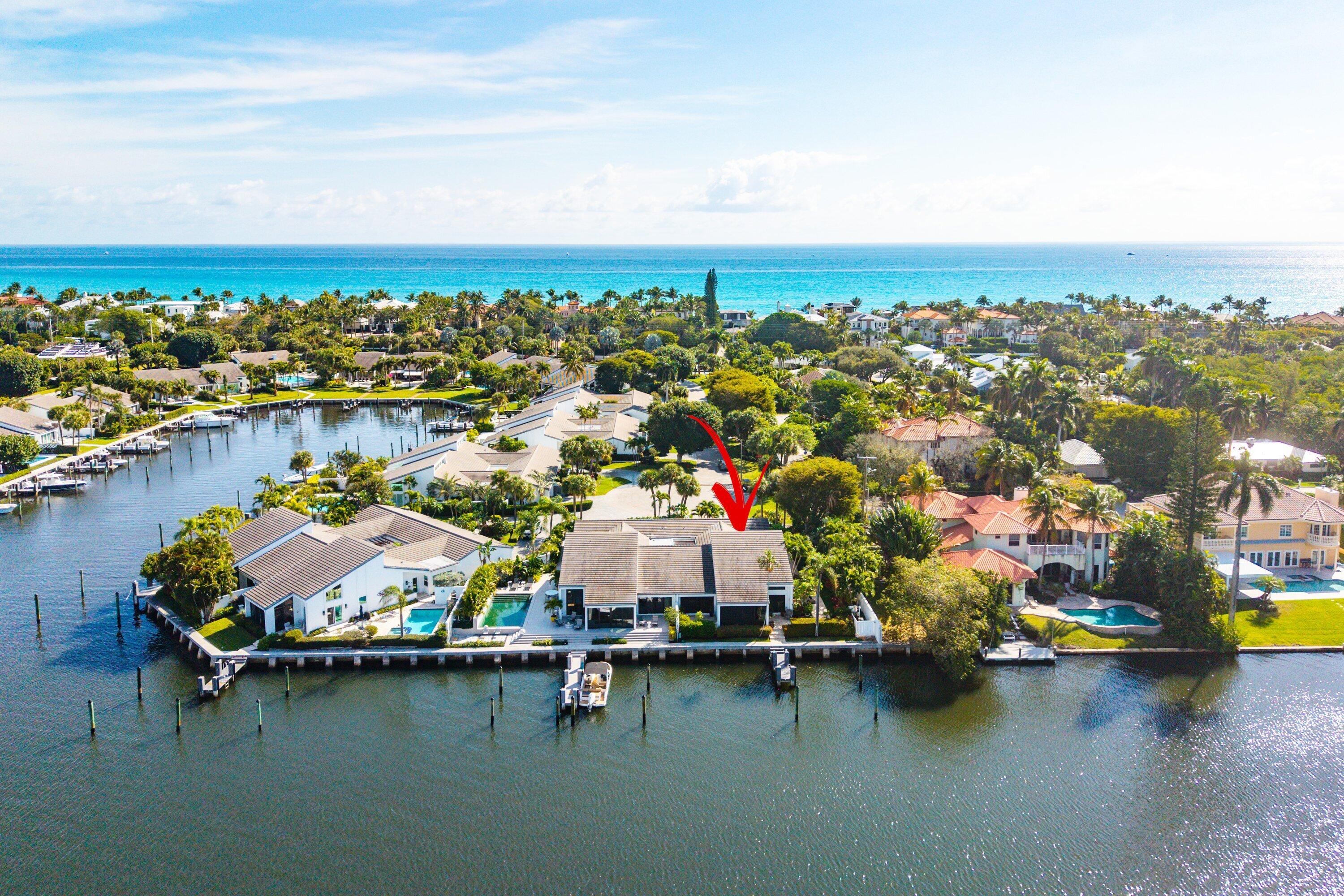 Experience the ultimate South Florida waterfront lifestyle in this private coastal retreat offering breathtaking, wide-water views across a protected wildlife sanctuary and the Intracoastal. With two private dock slips accommodating up to a 60' vessel, this is a rare opportunity for serious boaters seeking direct access and tranquility.  Ideally located just minutes to the Boynton Inlet with effortless ocean access, the property delivers the perfect balance of convenience and seclusion. Enjoy peaceful mornings watching native birds and marine life, and evenings filled with endless sunset views over shimmering open water.  This traditionally appointed 3-bedroom, 2 full and 1 half-bath residence is designed for coastal living. Light-filled interiors capture stunning water views from the main living areas.  The spacious primary suite offers a private retreat, and guest bedrooms provide comfort and flexibility for family or visitors.  Step outside to expansive waterfront living areas ideal for dining, lounging, and enjoying the coastal breeze. A secluded beach easement allows you to walk to the sand in minutes -- truly the best of both boating and beach lifestyles.  Private. Peaceful. Waterfront living at its finest.
