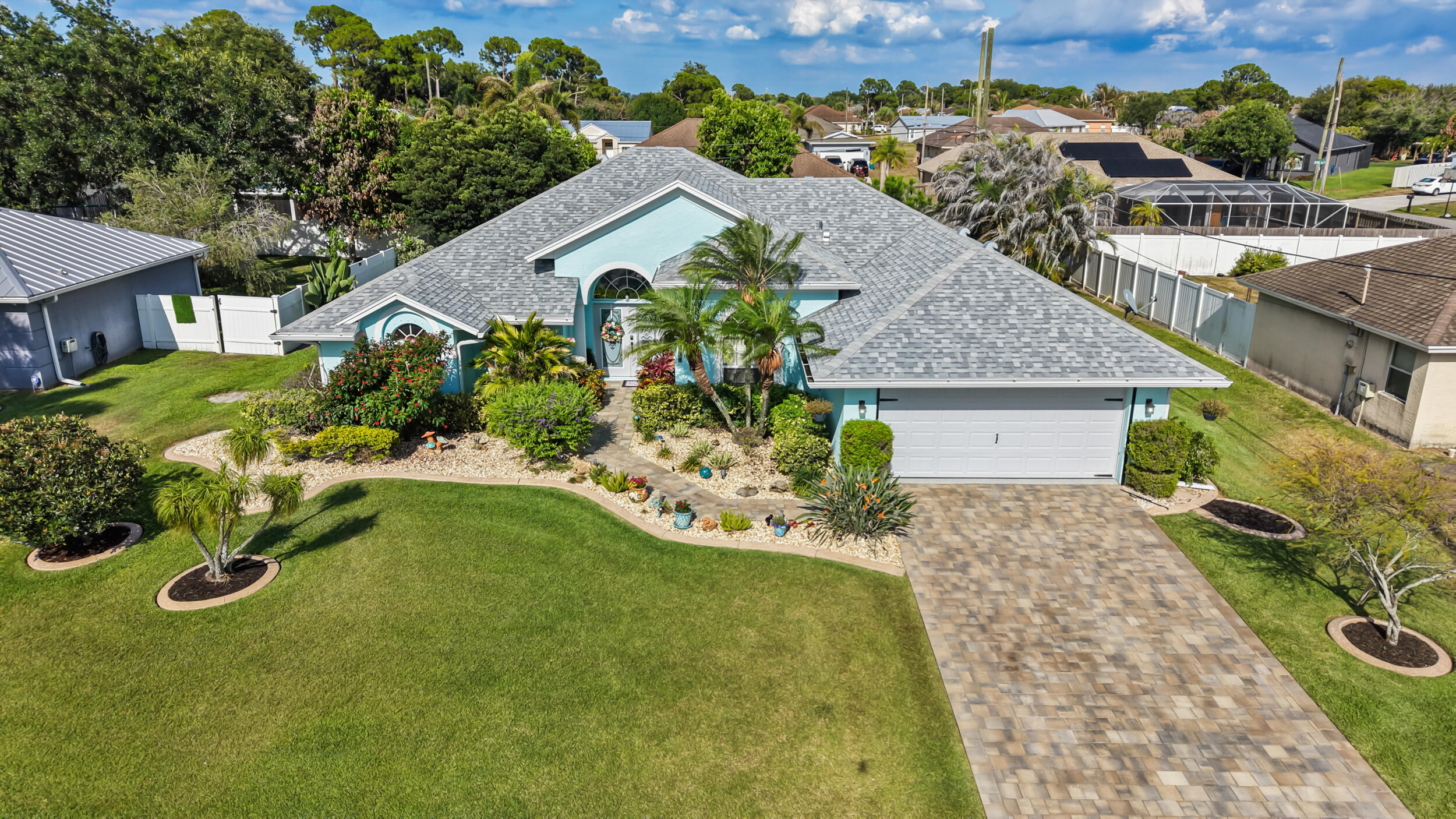 Welcome to this beautifully maintained 3BR/2BA pool home offers no HOA! Built in 2005, this move-in-ready home features an updated kitchen with quartz countertops, Samsung Bespoke appliances, kitchen island, refreshed cabinetry, and modern hardware. Enjoy Florida living in your private saltwater pool enclosed by a spacious screened lanai with plenty of room for outdoor dining and entertaining. Beautiful landscaping, decorative curbing, and a overlay paver driveway and walkways enhance the curb appeal. Major updates include a 5-year-old roof, exterior paint completed 5 years ago, and an A/C approximately 8 years old. The garage features epoxy floors, a motorized screen door, and attic storage access. Pride of ownership shines throughout!