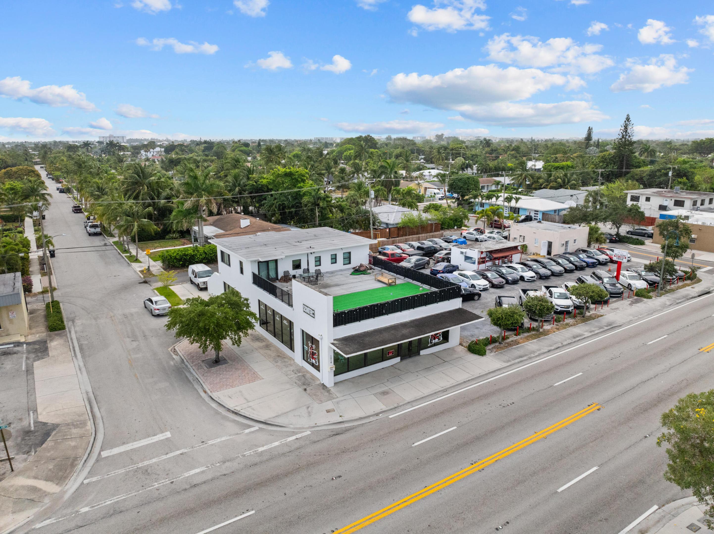 Prime Mixed-Use Corner Investment on N Dixie Hwy - Offered at $2.35M Exceptional opportunity to acquire a high-visibility mixed-use property in the desirable College Park area of Lake Worth Beach. Situated on a prominent corner at N Dixie Hwy & Vanderbilt Dr, this updated building features expansive storefront glass, impact windows, & modern finishes. The property includes a spacious ground-floor commercial unit with excellent frontage, a studio apartment on the first level, & a 2BR/1BA residence upstairs with a large private terrace and in-unit washer/dryer, offering multiple income streams and live/work flexibility. Ample parking includes rear spaces, additional side parking, & convenient street, public parking nearby. Efficient utility setup...MORE Efficient utility setup with separate electric for commercial and residential units and one water meter. Ideal for investors or owner-users seeking strong visibility, income potential, and long-term upside just minutes from Downtown Lake Worth Beach, the Intracoastal, and Palm Beach Island.