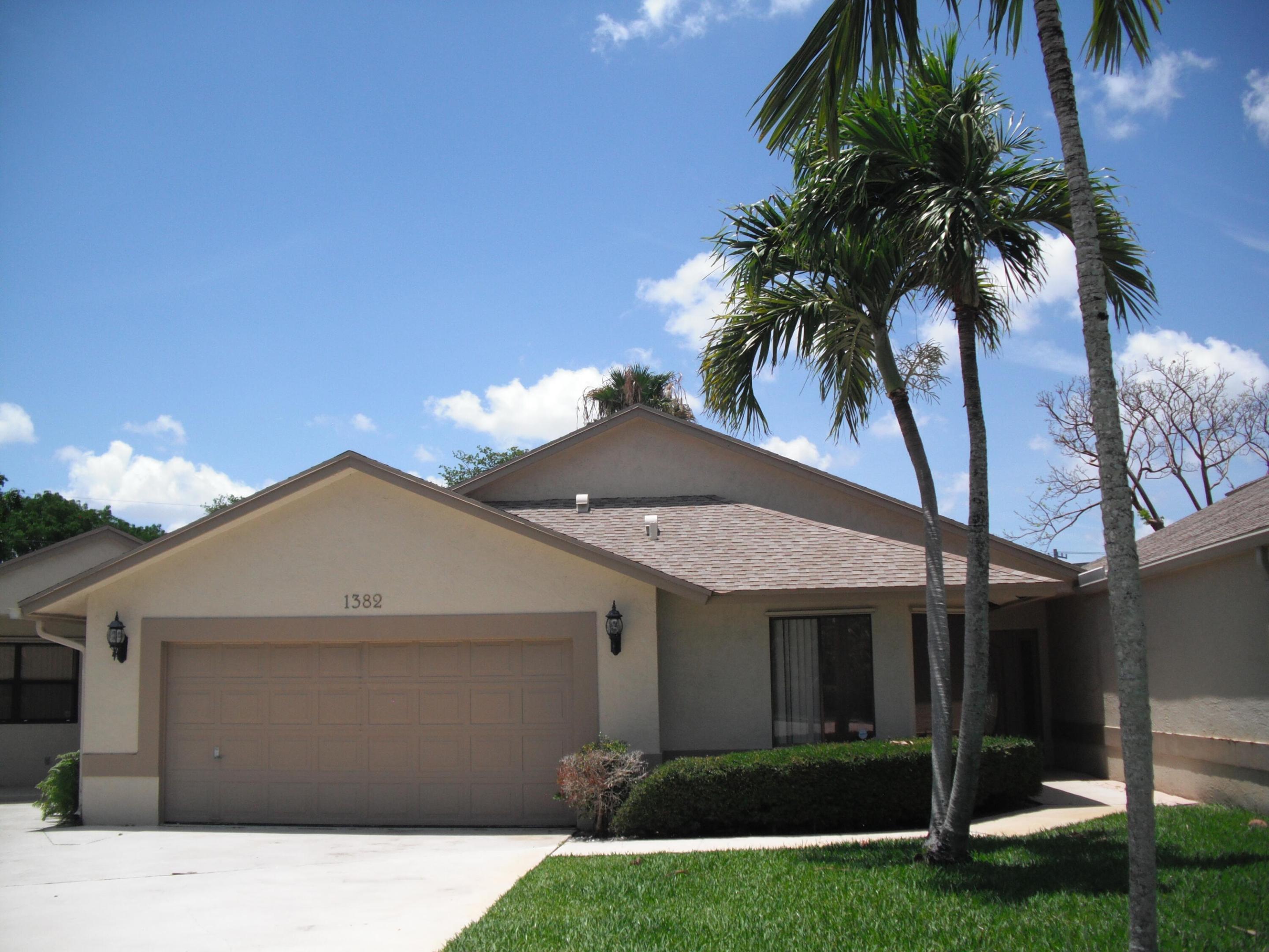 Updated 4bedroom / 3 bath unit with attached 2 car garage and pool, conveniently located in East Boca. Master suite includes 2 walk-in closets and a bathroom with dual sink vanity, roman tub and separate shower. Kitchen has wood cabinets and dark granite. The covered and open patio is just off living room and master bedroom.