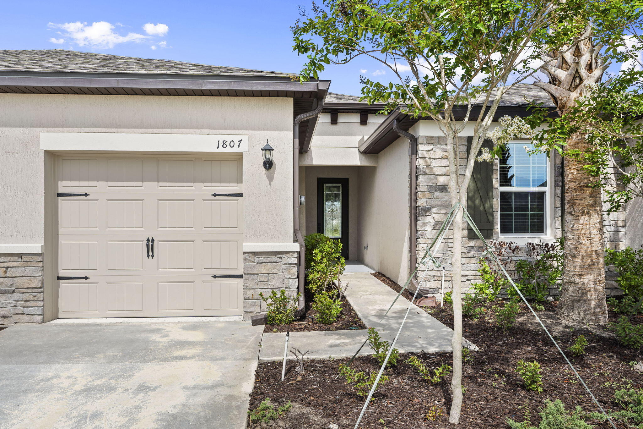 Discover the Patricio, a beautifully crafted single-story home designed with modern living in mind. From the moment you enter, you'll appreciate the bright, open layout that seamlessly connects the main living spaces, creating an inviting atmosphere for gathering with family and friends. The well-appointed kitchen serves as the heart of the home, featuring a spacious island, granite countertops, stainless steel Whirlpool® appliances, and ample storage. The private owner's suite offers a peaceful escape with a generous walk-in closet, while two additional bedrooms provide versatility for guests, family members, or a home office. Thoughtful upgrades, including professional front-yard landscaping and stylish finishes throughout, add to the home's appeal. Situated in the desirable Celebration