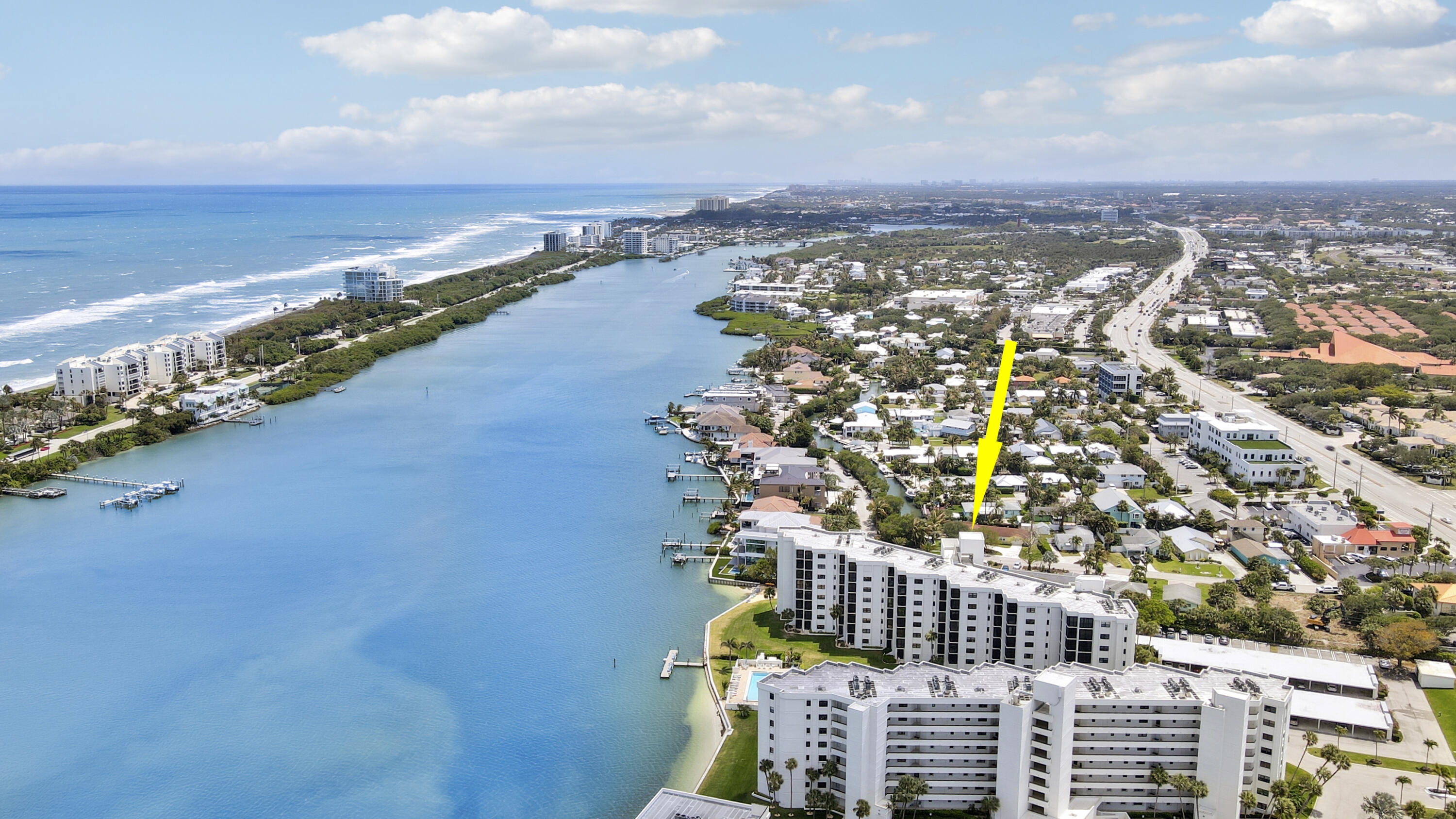 Waterfront living at its finest. This beautifully upgraded 2-bedroom, 2.5-bath residence features all-new impact windows and a screened-in balcony showcasing breathtaking views of the Intracoastal, Jupiter Island, and the Atlantic Ocean. Light-filled interiors offer stunning water views from every room, while the kitchen even captures views of the iconic Jupiter Lighthouse. Enjoy peaceful ocean breezes and endless boat activity, all from the comfort of your home. Resort-style amenities complete the lifestyle, a day dock for the community, kayak and paddleboard storage, grills, and a beautifully updated recreation space. Covered parking and a private storage unit provide everything you need to fully embrace the Jupiter and Tequesta lifestyle. Ideally located, you can walk to Jupiter Pointe  Marina and enjoy nearby favorites like Blue Pointe Bar & Grill, along with several island hot spots, restaurants, bars, and shopping. A true standout and a must-see.