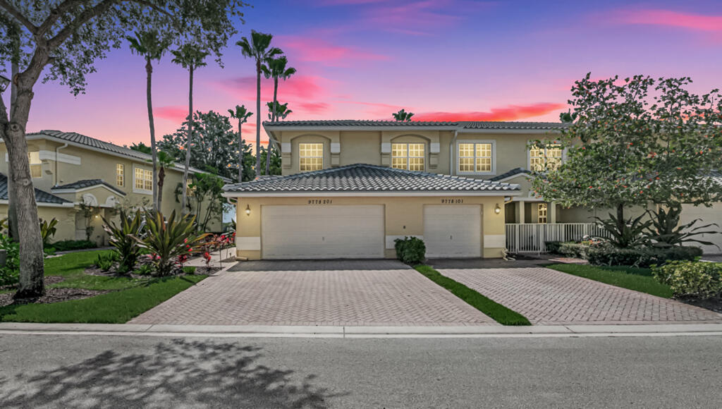 This gorgeous coach home has it all. PRICE! BRAND NEW ROOF, IMPACT WINDOWS, PRIVATE ELEVATOR AND OVER 2400 SQUARE FEET OF LIVING SPACE. 3 bedrooms, 2 full baths and a 2-car garage with epoxy flooring set this home apart. Among the many features of the home is a new wi-fi high end refrigerator and stove, new pro-line water heater, new washer 2025, nest thermostat 2023, ac 2022 with ozone free scrubber, custom motorized, blinds in primary bedroom, crown molding throughout, tray ceiling in primary, huge walk-in closets in all 3 bedrooms, very large laundry room, separate formal dining and living room. The water view is stunning. This is also a corner unit with extra windows in the formal dining room and family room, letting in all the natural light. Enjoy peace of mind with 24 hr. guard gate. HOA FEE INCLUDES WATER, ROOF MAINTENANCE AND REPAIR/REPLACEMENT, EXTERIOR HOMEOWNERS INSURANCE, LANDSCAPING, EXTERIOR PAINT, ADT ALARM SYSTEM, HIGH SPEED INTERNET, PREMIUM CABLE CHANNELS, WHICH INCLUDE SHOWTIME, HBO, CINEMAX, AND MORE. You don't need to spend high prices for all of these items separately. Enjoy the huge saving on homeowners' insurance as well! Clubhouse amenities include pickleball, tennis, bocce, shuffleboard, resistance pool, lap pool, resort pool, hot tub, covered lanai, card rooms, craft room, ballroom for shows, movie room, billiards, library, gym, sauna and yoga/line dancing flex space. This 55+ community is truly a paradise. 80/20 rule applies. You can own here at any age as long as there are no children under the age of 19 residing in the home. The already fabulous clubhouse will be going through a renovation this Fall/Winter. Be sure to visit the clubhouse to see the future look of the interior. The pool area will remain open and useable during the renovation as well as all outdoor activities. Come see what everyone is talking about. You deserve to live in the Florida lifestyle!