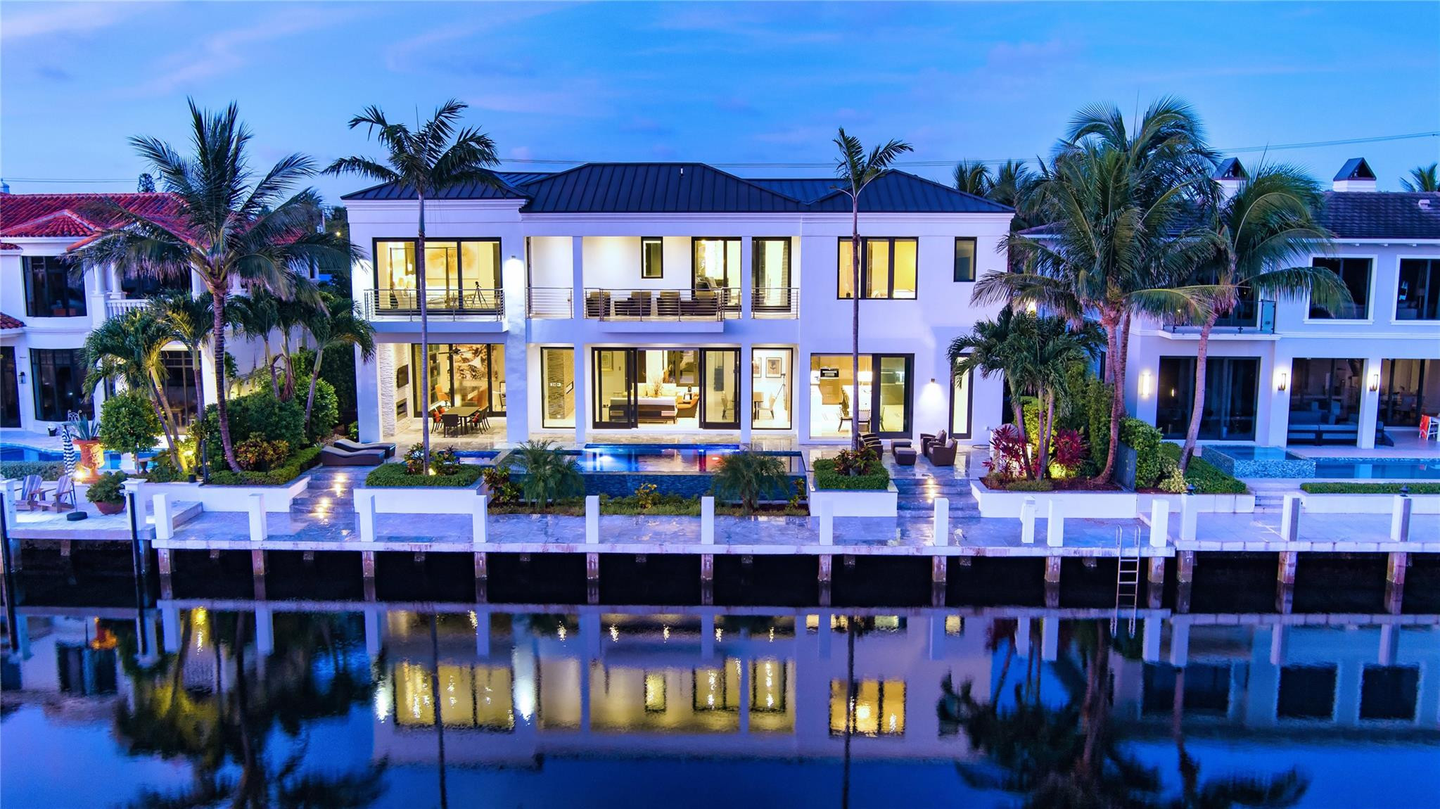 Chic, Modern Deepwater Estate sited on 90+/- feet of waterfrontage on the wide South Grand Canal. Interiors by famed designer, Fanny Haim, this residence sets a new standard for living, with craftsmanship and materials that assure peace of mind. Awe-inspiring views down the waterway from every major room including a gourmet chef's kitchen and luxurious master suite with two separate spa-baths. Amenities include elevator, 22kw gas generator, custom built-ins, Savant Home Automation, electric shades, 3 bay garage, and more. Outdoor entertainment is enjoyed at the heated, resort-style infinity-edge pool with spa and covered lanai with fireplace. Ideal for the avid boater, the 90’ concrete yacht dock is sited on a large turning basin just minutes to the Hillsboro inlet. DISCLAIMER: Information published or otherwise provided by the listing company and its representatives including but not limited to prices, measurements, square footages, lot sizes, calculations, statistics, and videos are deemed reliable but are not guaranteed and are subject to errors, omissions or changes without notice. All such information should be independently verified by any prospective purchaser or seller. Parties should perform their own due diligence to verify such information prior to a sale or listing. Listing company expressly disclaims any warranty or representation regarding such information. Prices published are either list price, sold price, and/or last asking price. The listing company participates in the Multiple Listing Service and IDX. The properties published as listed and sold are not necessarily exclusive to listing company and may be listed or have sold with other members of the Multiple Listing Service. Transactions where listing company represented both buyers and sellers are calculated as two sales. Some affiliations may not be applicable to certain geographic areas. ?Information published or otherwise provided by seller, listing company or its representatives is deemed reliable but are not guaranteed and subject to errors, omissions, or changes without notice. If your property is currently listed with another broker, please disregard any solicitation for services. Copyright 2024 by the listing company. All Rights Reserved.