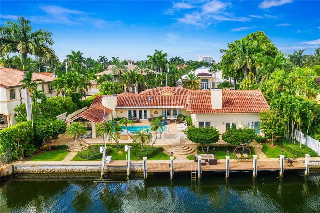Superbly located on one of Harbor Beach's most desirable Isles with rare 120 ft of deepwater with approx 11ft depth, 135ft wide canal & 18,000sf property. Immaculately presented on one level with a great balance of formal & casual entertaining areas.Impact glass & 2011 new roof.Kitchen is open to expansive great room, formal areas include elegant dining & living rooms plus library/den. Varying ceiling heights add interest & character.The Master Suite is approx 1,200 sf, vaulted ceilings, great closets & spa style bathroom plus pool & views! Floorplan allows privacy to the other well sized bedroom. Outdoor entertaining is a huge focus with covered gazebo bar & dining plus Summer Kitchen & oversized pool. Beach lovers enjoy the private Surf Club & additional boats may be docked at the Marina Electrical and water bills range from $750 to $1,000 per month.Insurance is $13,058 annually with a 25% hurricane deductible Impact Glass installed 20072011 stone patio and pool area installedBoat Lift approx 10,000 lb