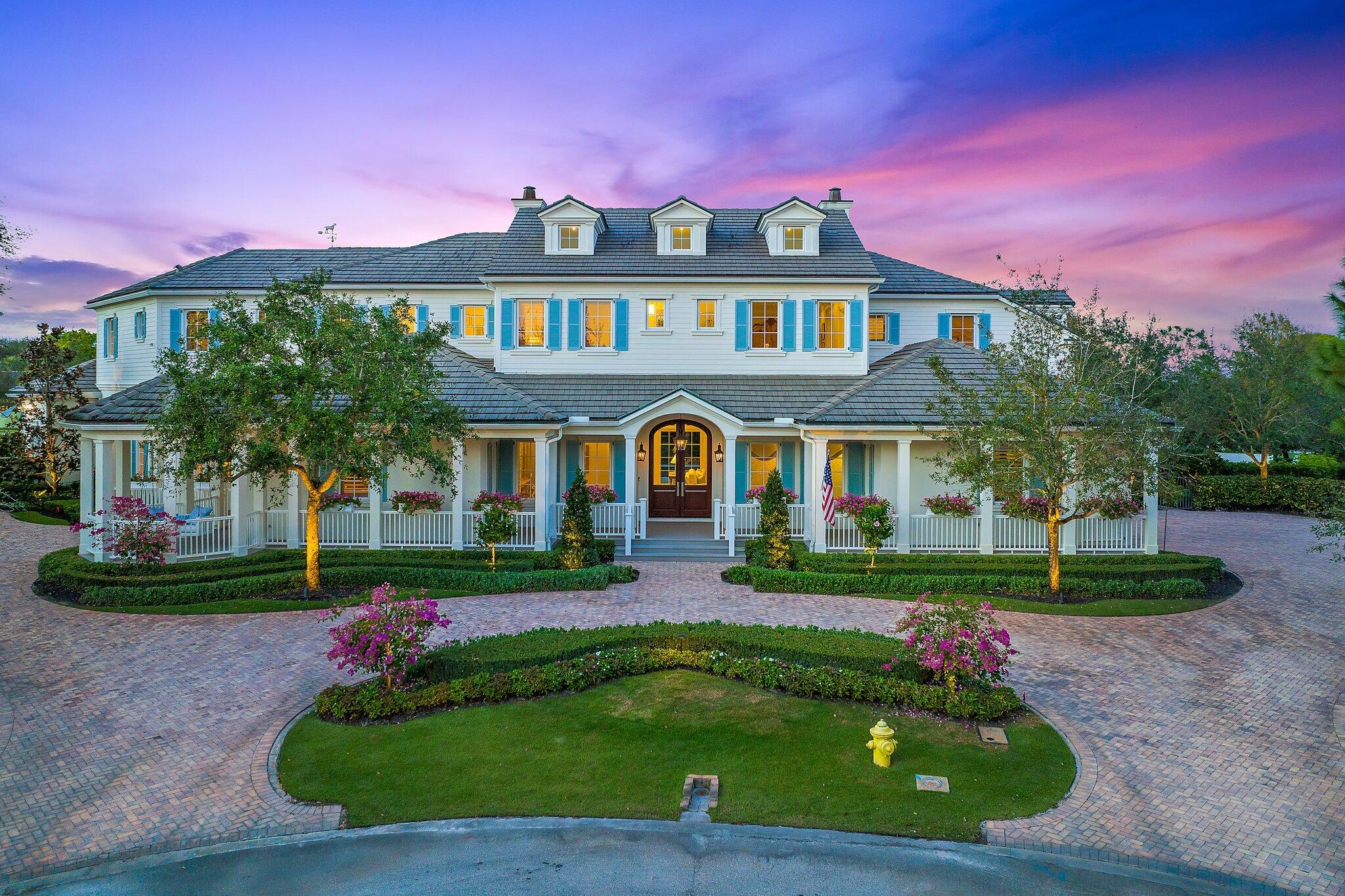 This exquisitely beautiful home tucked away within the intimate gated community of Old Marsh Golf Club is one of the best kept secrets in the area! Surrounded by scenic nature preserves, lakes and golf course views, this tailor fit home was recently renovated by the elite custom home builder, Turtle Beach Construction. 
This masterpiece was originally built in 2014 by Maxwell Construction, blending Edgartown and Augusta architecture featuring three stories, multiple outdoor porches, open kitchen, and family rooms, two primary suites, a wine room, two offices, Lutron lighting, brand new flooring throughout and the expansive backyard features the large swimming pool and views of championship golf course. The list of upgrades are endless at this breathtaking estate! Old Marsh offers 180 half-acre home sites with marsh, lake, or golf course views. All the residences here are custom estate homes and many are situated on two or three lots. The championship golf course was designed by the highly acclaimed architect Pete Dye and consistently has been ranked one of the best courses in the United States. Old Marsh Golf Club, with its newly renovated clubhouse, decorated in rich dark woods and comfortable fabrics that create a warm and friendly atmosphere, continues to preserve the true traditions of golf. Here, no starting times are required, and a nationally acclaimed caddy program enriches your experience on the course. Old Marsh Golf Club is recognized as one of the top 35 private clubs in the country and Audubon International awarded it certification for its environmentally enhancing design and maintenance. Birds, fish, and other wildlife abound at Old Marsh, yet it is still just minutes from all the shopping, dining, and entertainment venues of the Northern Palm Beaches. The Gardens Mall is but a short drive away, as is the Intracoastal, the Atlantic Ocean, Worth Avenue, City Place, the Kravis Center, many fine public and private schools, and the Palm Beach International Airport.