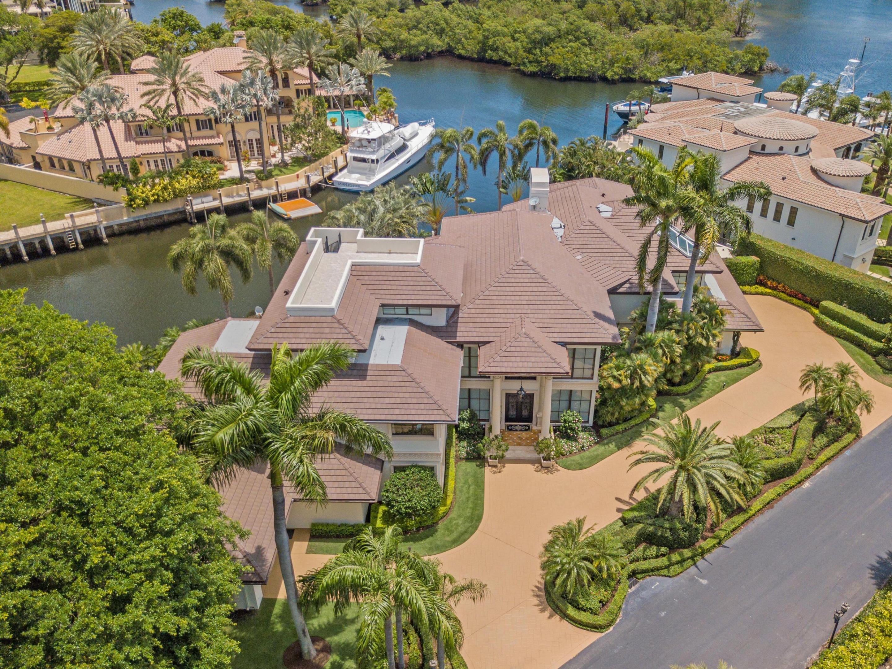 Located in the Sanctuary of Boca Raton, a world-renowned secure gated community, this completely reimagined, in 2011, Belle Poch waterfront estate offers it all. Meticulously maintained and upgraded by the current owners. With over 15,000 interior square feet, this estate leaves nothing out including over 200' of water frontage and 1000' to the main ICW. From the gorgeous flooring with inlaid stone, marble, granite, and onyx to ceiling details that are reminiscent of a Grand Palazzo including Venetian plaster. The moment you enter you are amazed at the grand butterfly staircase and crystal chandelier, a motorized chain, (of course), that greets you in the main foyer. A fully outfitted elevator may also
be used to access the 2nd floor.   Owner's study with custom cabinetry, wine cellar Located in the Sanctuary of Boca Raton, a world-renowned secure gated community, this completely reimagined, in 2011, Belle Poch waterfront estate offers it all. Meticulously maintained and upgraded by the current owners. With over 15,000 interior square feet, this estate leaves nothing out including over 200' of water frontage and 1000' to the main ICW. From the gorgeous flooring with inlaid stone, marble, granite, and onyx to ceiling details that are reminiscent of a Grand Palazzo including Venetian plaster. The moment you enter you are amazed at the grand butterfly staircase and crystal chandelier, a motorized chain, (of course), that greets you in the main foyer. A fully outfitted elevator may also be used to access the additional floors. Owner's study with custom cabinetry, wine cellar of 1000+ bottles, dining room with fireplace, spectacular living room with waterfront views, sunken wet bar that is fully equipped, and additional fireplace for ambiance. A sound-reduced media room is also located on the main level as is the gourmet kitchen informal dining, butler's pantry/kitchen, and laundry room. On the second story, you will find the Owner's suite with a private balcony, seating area and dual custom closets, and of course completely separate water closets. Two additional ensuite bedrooms, a 2nd laundry room, an informal lounge area, and multiple storage areas.  The 3rd level has a sauna and an additional ensuite bedroom with a balcony. The 4th level provides complete outdoor privacy. Custom summer outdoor kitchen overlooks the heated pool and Sanctuary for which the community is named.  2020 replaced roof, 12 HVAC's all with maintenance contracts, 11 of which have REME  air purification systems and 2 KW whole house generators also with maintenance contract.  All impact windows and doors with screens and custom draperies, full house interior and exterior sound system. Pool heater still under warranty.  Entire home on ADT security including fire detectors and home sprinkler system.  The statement "your home is you fortress" has never been more true with this amazing waterfront estate