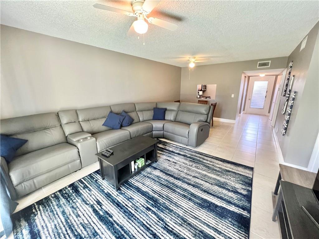 GREAT FIRST FLOOR LOCATION IN VILLAGES OF ORIOLE ABBEY SECTION! ALL WINDOWS AND SLIDERS ARE IMPACT!!! PARTIALLY FURNISHED W/ LARGE TILE THROUGHOUT THE HOME. BOTH BATHROOMS HAVE HIGHER END UPDATES, FRAMELESS SHOWER DOORS, PEBBLESTONE FLOORS AND NICHES. KITCHEN BOASTS STAINLESS STEEL APPLIANCES.  A/C IS NEWER (2 YRS OLD)..WHAT MORE CAN YOU ASK FOR! VILLAGES OF ORIOLE (ABBEY VILLAGE) OFFERS A CLUBHOUSE, POOL, CARDS AND BILLIARD ROOMS, FITNESS CENTER AND MORE! ASSOCIATION CLAIMS 55 PLUS..ALL LOCATED CLOSE TO SHOPPING AND THE BEAUTIFUL BEACHES OF SOUTH FLORIDA