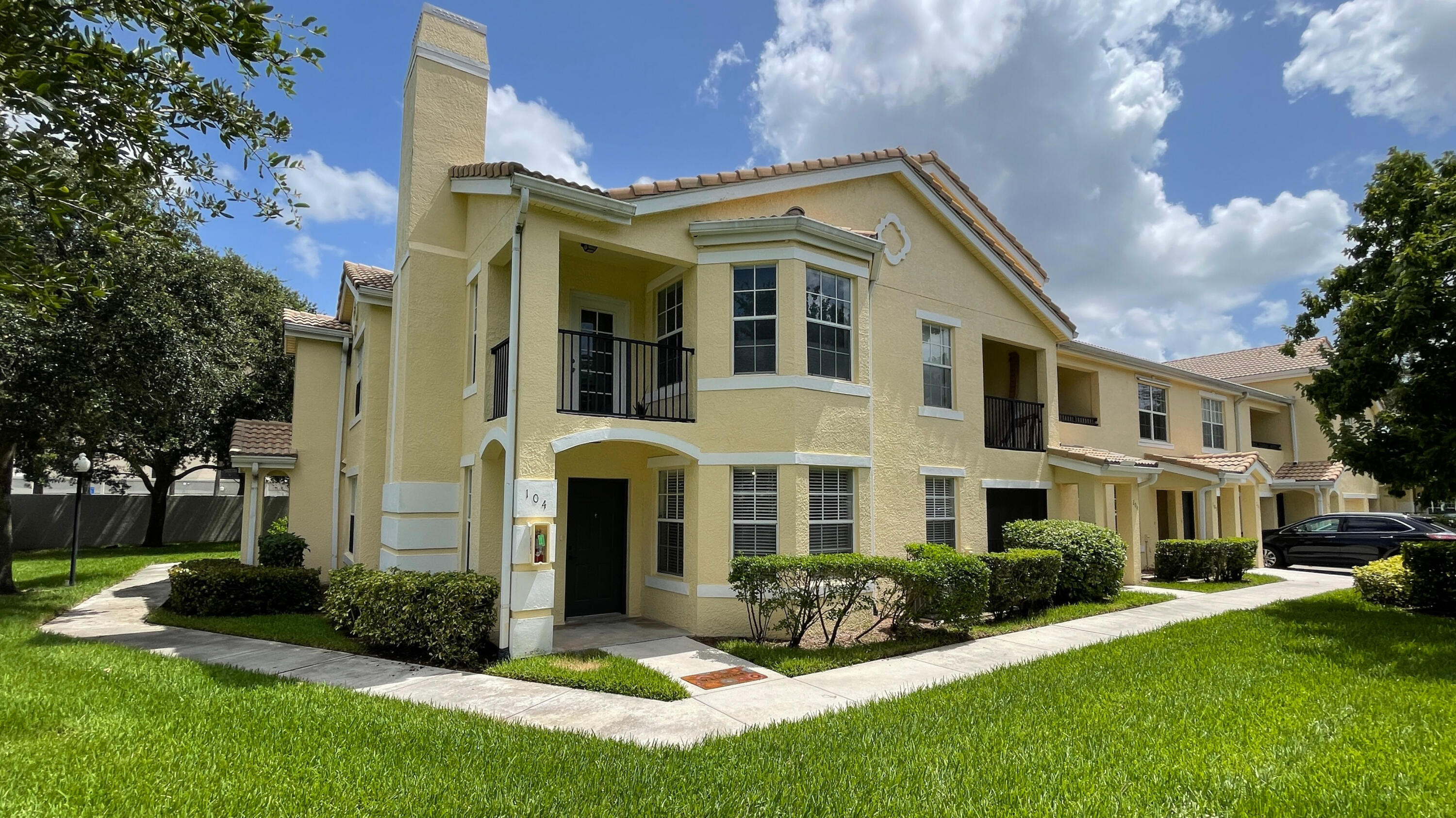 Beautiful, spacious & well maintained downstairs, corner 2b/2b condo unit with lots of storage, 2024 AC, large windows provide ample natural light, screened patio accessible from master bedroom & kitchen. Newer stainless steel appliances, full-size washer & dryer, washer is from 2026, tile/vinyl flooring throughout, tankless water heater and a Reme Halo Lamp attached to AC. Unit comes with one assigned parking space. Beautifully landscaped and well-maintained gated community which offers a resort-style heated swimming pool & spa, 24-hour fitness center, tennis court, multi-media room, valet trash service. Short walk away to restaurants, shopping, entertainment, Met's Stadium; 5 min drive to golf courses, Tradition, IRSC. Right off I-95, < 30 min to beaches, parks,  recreational waterways for boating & fishing, 45 min to PBI Airport.
