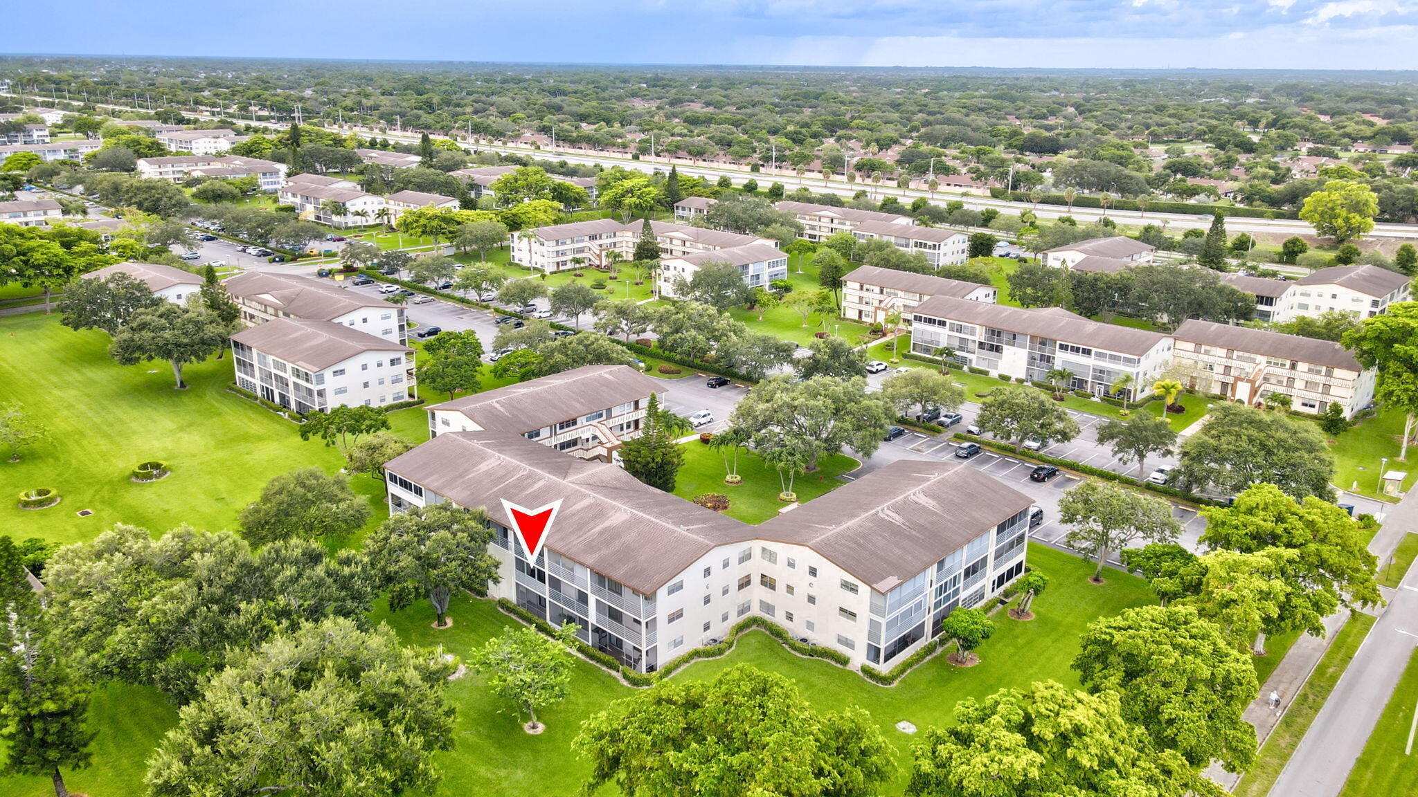 Beautiful updated condo with screened in  lanai overlooking lush courtyard. White kitchen cabinets with Stainless Steel appliances and new flooring and paint.  Bath is updated with walk-in tiled shower. Bedroom with ceiling fan. AC and water heater 2023. The Clubhouse large pool deck area shuffleboard tennis bocce  theater pickle ball laundry and fitness center. Bus service too.  55+ community with shopping restaurants and so much more Boca has to offer.