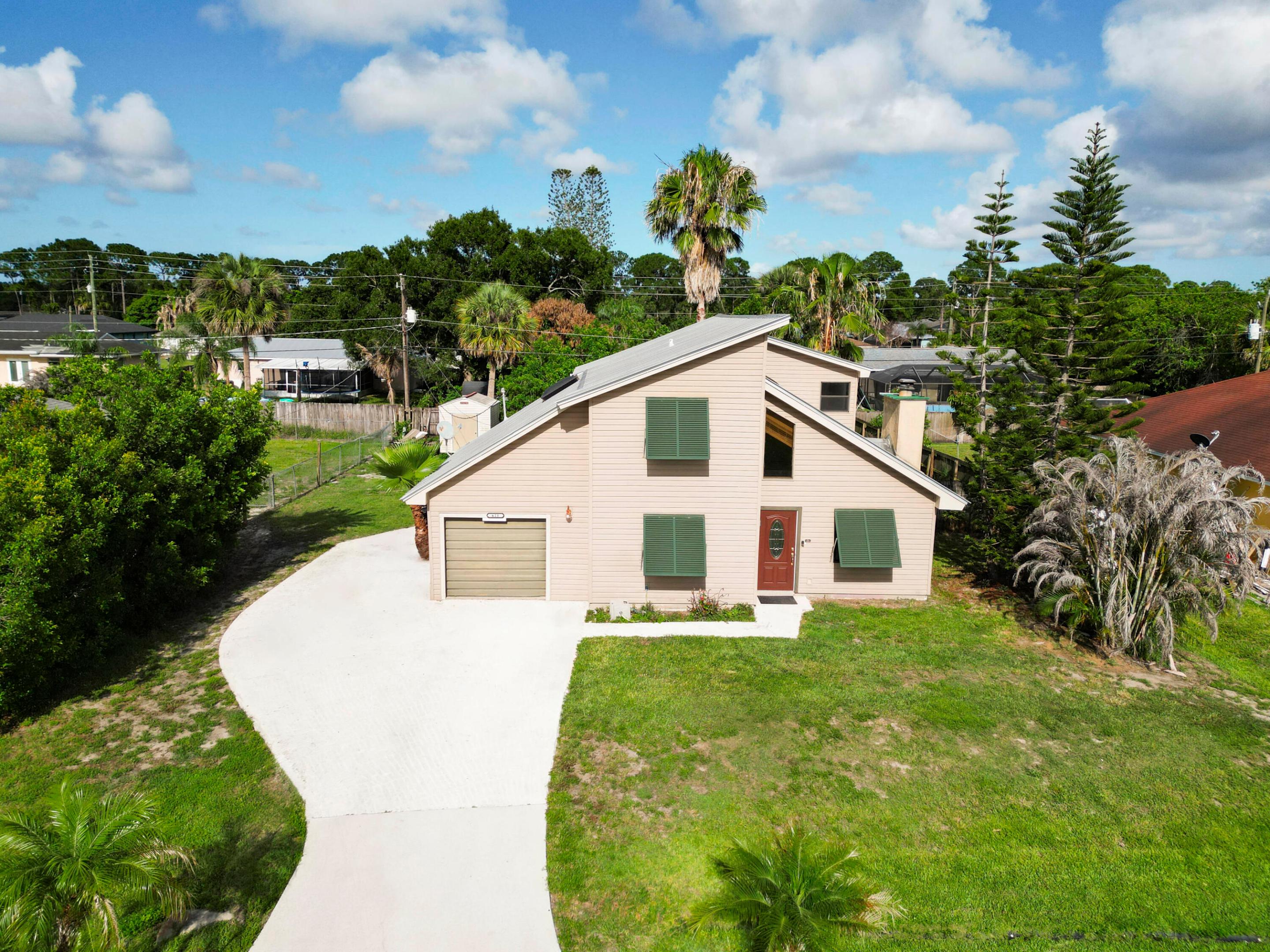 Location,location,location! Welcome to this beautiful two-bedroom, two-bath metal roof home featuring a versatile den that can be used as a home office or additional bedroom.Nestled in the heart of Port St.Lucie, this one of a kind property offers comfort, style and convenience all in one.A true must-see with exceptional potential-this opportunity will not last long.Schedule your showing today before it's gone!