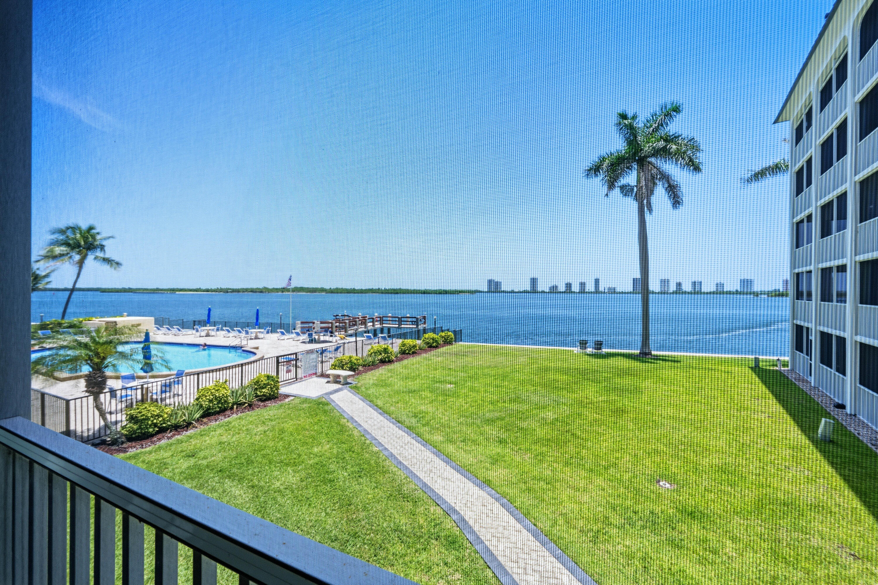 Some of the best panoramic water views in North Palm Beach.  This beautifully positioned waterfront residence in Paradise Harbour is overlooking the Intracoastal Waterway.  The Balcony has glass sliders and can be used as living space year-round.  The beautiful 2BR/2BA condo offers the best coastal vibe. The well-designed floor plan features expansive living areas, generous bedrooms, and seamless indoor-outdoor living.  Paradise Harbour offers resort-style amenities including a waterfront pool, fitness center, elevator access, and a prime North Palm Beach location just minutes from beaches, marinas, golf courses, fine dining, and upscale shopping.  DON'T LET THIS ONE SLIP AWAY.