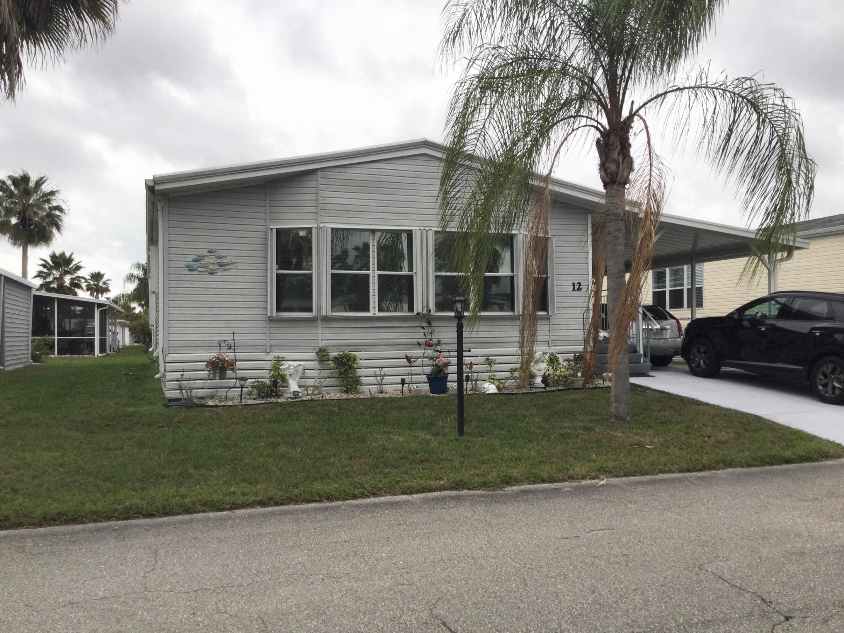 ONE OF THE LARGEST HOMES IN THIS COMMUNITY.  THIS 1560 SF HOME IS LOCATED IN THE MUCH SOUGHT AFTER SPANISH LAKES COMMUNITY AND HAS BEEN METICULOUSLY DECORATED AND MAINTAINED.  ROOF, AC, AND HOTWATER HEATER INSTALLED IN 2000.  LAND LEASE COVERS ALL AMENITIES, TAXES, LAWN CARE AND TRASH REMOVAL.  AMENITIES INCLUDE GOLF,2 POOLS, TENNIS, PICKLE BALL, TENNIS, SHUFFLEBOARD, BOCCE, HORSE SHOES, BILLIARDS, PING PONG, COMMUNITY ROOM, PARTY ROOM, LIBRARY, GAME ROOM, DOG PARK AND MUCH MUCH MORE.  DO AS MUCH AS YOU LIKE OR JUST SIT BY THE POOL AND RELAX.  SPANISH LAKES IS A 55+ COMMUNITY.  FUTURE RESIDENTS MUST BE APPROVED BY SPANISH LAKES.  CALL FOR APPLICATION.