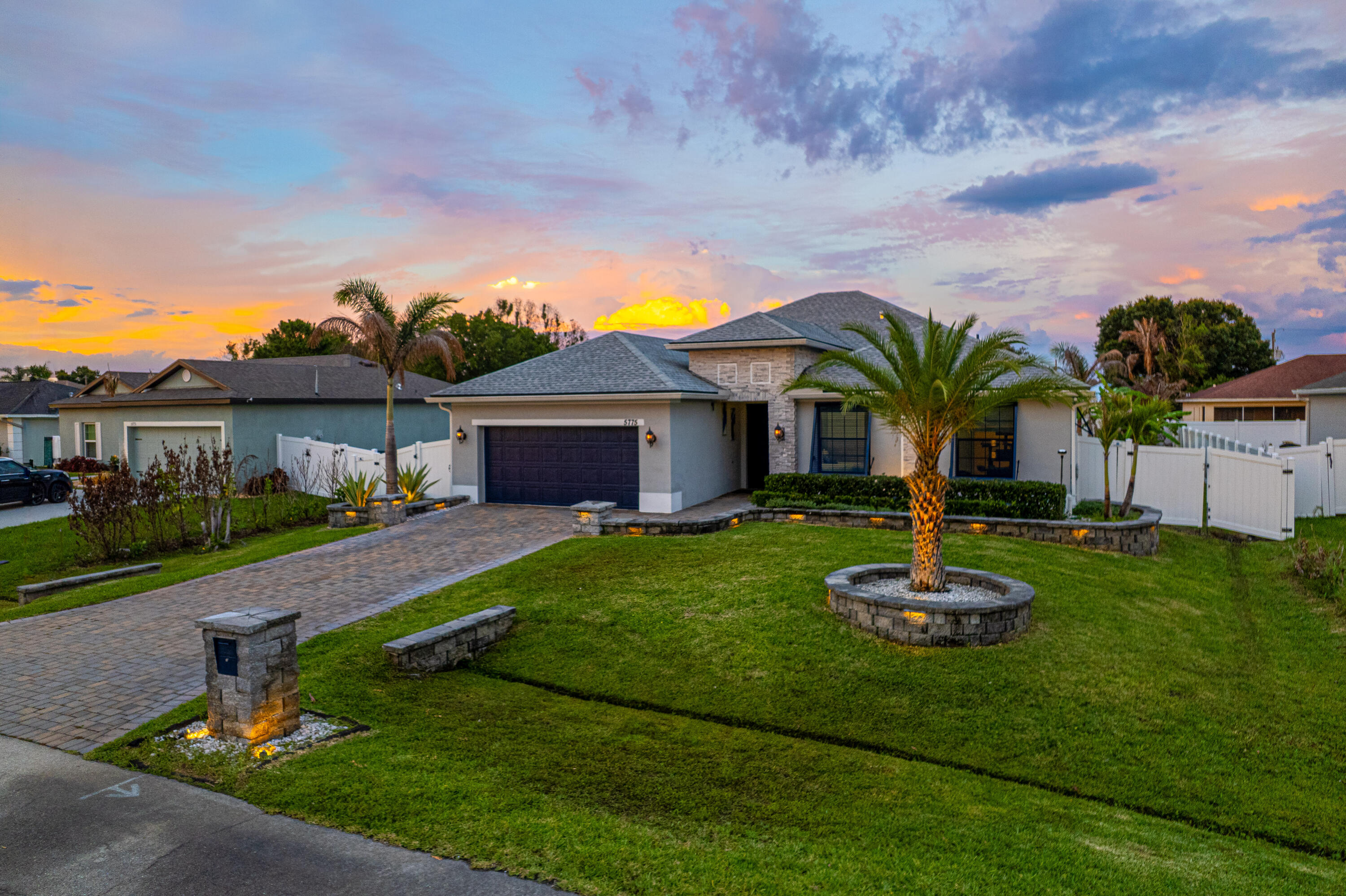 Beautiful 4-bed, 3-bath home with custom masonry in front and a fully fenced yard in the back. This stunning 2,105 sq. ft. residence sits on nearly a quarter-acre lot, showcasing premium St. Augustine grass that stays vibrant thanks to an in-ground sprinkler irrigation system that pulls from well water. Inside, you'll find a light and bright open kitchen with granite countertops and a spacious walk-in pantry perfect for entertaining. The home offers ultimate peace of mind and energy efficiency, fully equipped with impact windows and doors. Outside, you'll love the sophisticated paved driveway and the personal hot tub and patio overlooking a beautiful garden. Skip the construction wait and move right into this pristine masterpiece today!