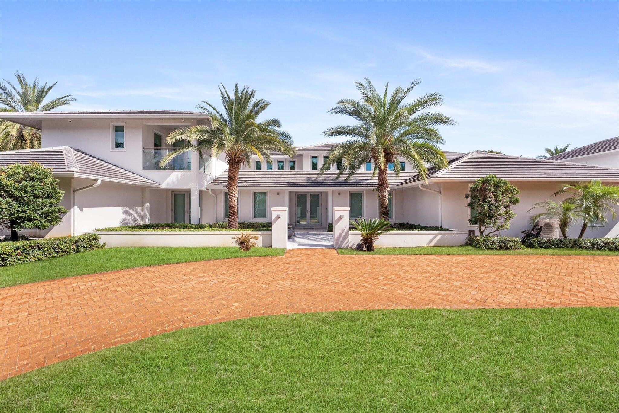 Set behind double gates in the prestigious enclave of Fieldbrook Estates, this exceptional estate redefines luxury living. Spanning nearly 9,000 square feet, the residence offers 7 bedrooms and 7 bathrooms, including a separate two-story guest house, all set on a beautifully landscaped one-acre lot designed for privacy and resort-style living. Sun-filled interiors showcase open, elegant living spaces finished with porcelain tile, hurricane-impact windows, and thoughtful custom details throughout. The chef's kitchen, complete with a walk-in pantry, flows seamlessly into formal and casual gathering areas ideal for entertaining. The first-floor primary suite is a true retreat, featuring three walk-in closets, a spa-inspired bath, serene pool views, and an outdoor Jacuzzi.  Additional highlights include an office, dry sauna, and expansive family room, while the upper level offers four additional bedrooms, a second family room, and a spacious upstairs suite. Outdoors, the private backyard feels like a five-star escape with a resort-style pool and spa surrounded by lush landscaping. A six-bay showcase garage and impeccable attention to detail complete this rare offering—an extraordinary opportunity to own a private estate in one of the area's most sought-after communities.