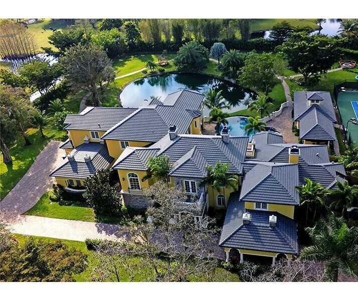 Spectacular, Grande Manor on sprawling 3 acres completely fenced and gated entrance with private lake, gazebo, fire pit, guest house. and gym. New custom pool. This estate offers 16,578 + sq ft of total living space, including 6 bedrooms, 6 full and 2 half baths plus library, elevator, theater, wine cellar, loft, 3 wet bars, 3 fireplaces, and 4 car garage. Professionally decorated with attention to detail and the finest materials