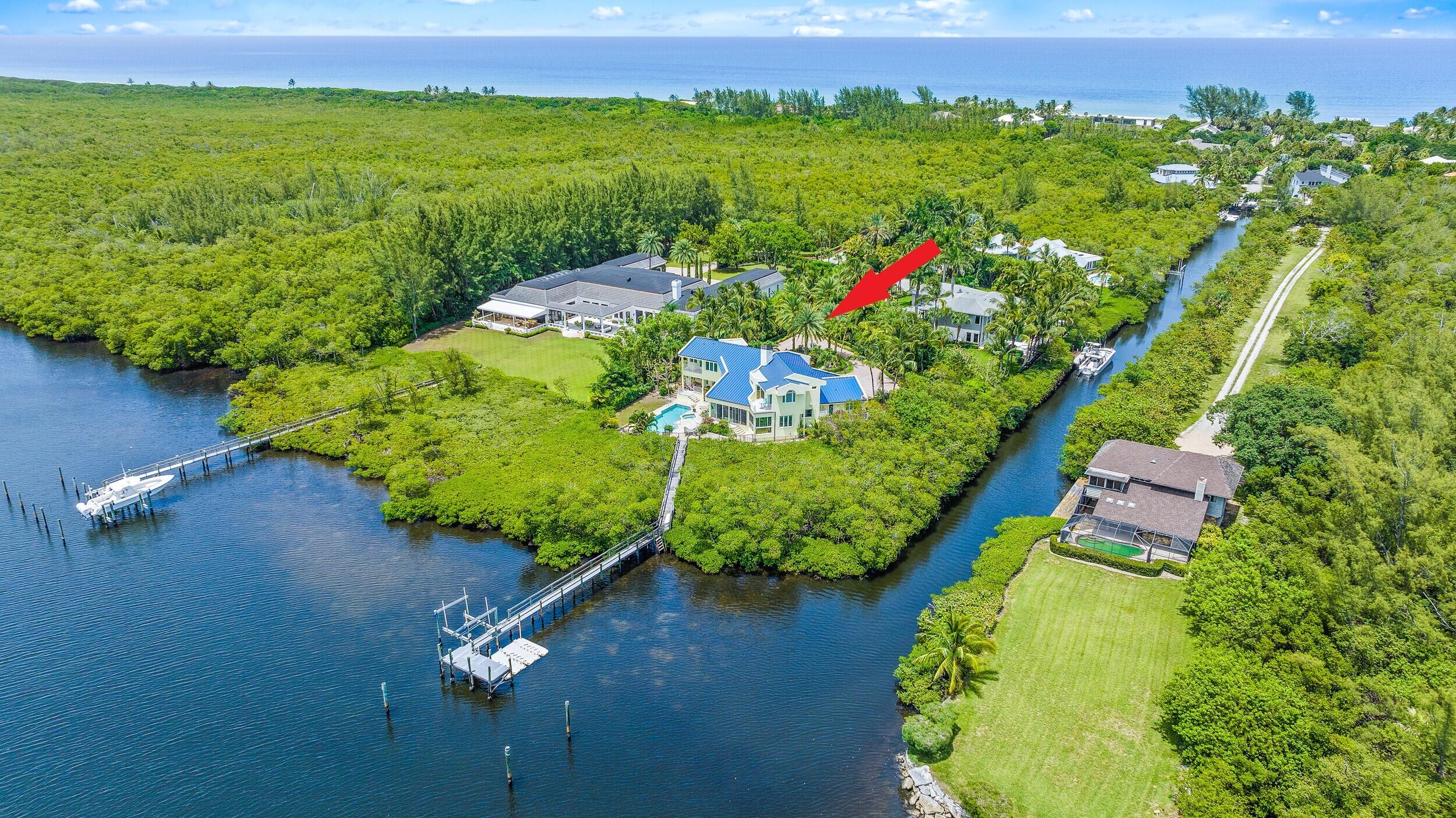 Tropical Paradise on Jupiter Island. Direct Intracoastal & panoramic views from this privately located 1 acre point lot. 360 Ft of waterfront. Dock will accommodate a large yacht & includes 16K lb lift. Impact glass windows & new Metal roof in 2020. Much sought after beach access. 4 bed Plus den/media room, 4.5 baths. Two master suites offer renovated bathrooms complete with walk in closets and captivating water views. 2nd floor master bath with access to a private balcony & stairway to pool & patio. Chef's kitchen includes 6 burner Bright & airy sun room overlooking water & heated pool & spa. Saturina stone floors & 2 coquina stone fireplaces, Whole home generator. Vaulted ceiling, cedar lined wine room wet bar & wine coolerGuest bedroom with access to private balcony and renovated ensuite bath. Cozy loft and bonus room. Travertine stone pool decking. Lushly landscaped lot offering the utmost in privacy.
Enjoy stunning sunsets from every room.