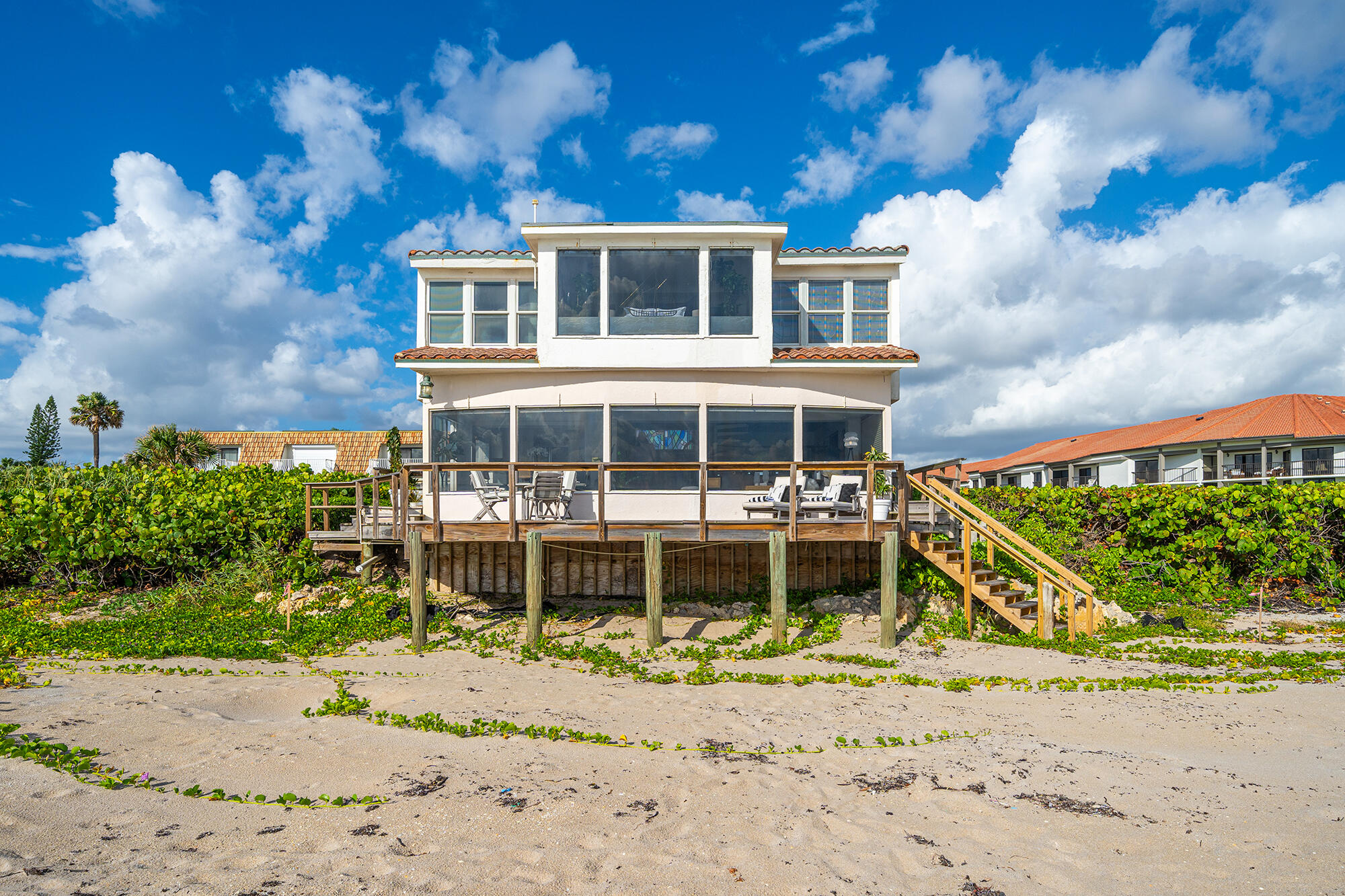 One of a kind ultimate beach house directly on the sand! Rarely available, SEAWATCH enjoys the south Florida splendors - morning sunrises, salty air, and panoramic views of the ocean.  SEAWATCH is a sophisticated coastal gem but with a relaxed feel.  This unique, exceptionally private home offers two bedrooms plus an office or room for a third bedroom to be enjoyed by family and friends. Situated on a pristine location where land meets the sea this healthy haven provides privacy and multiple outdoor spaces to enjoy your fitness and wellness routines - yoga, swimming, paddle boarding, surfing or al fresco dining on the open air patio. Host beach volleyball or simply enjoy a cheeseburger in paradise! Conveniently located to Palm Beach, dining and shopping.