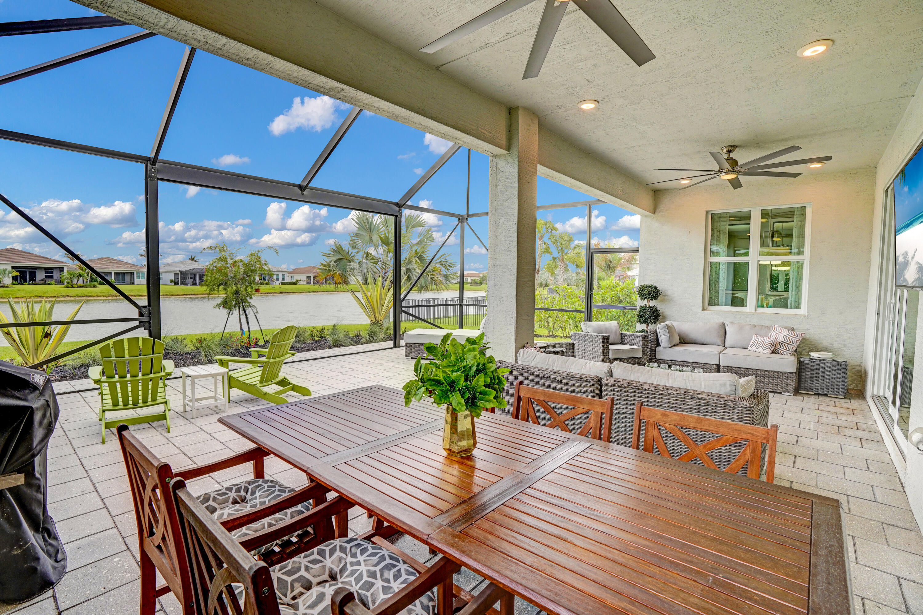 Cresswind at Verano |over 55 Community | Lakefront | Move-In Ready Some homes check boxes. This one stops you in your tracks. From the moment you pull up, the upgraded landscaping, evening lighting, and lake backdrop tell you this is something different — and the inside delivers on every promise. THE LANAI CHANGES EVERYTHING Step outside and you're not on a patio — you're in a second living room with nature as your feature wall. Custom flooring, floor-to-ceiling screens, panoramic lake views, and layered landscaping with evening lighting. Coffee at sunrise. Cocktails at sunset. This is the Florida life you imagined. A KITCHEN WORTH GATHERING IN Redesigned quartz island with seating, 42" cabinetry, under-cabinet lighting, custom pendants, finished pantry, electric cooktop with  stainless hood and combo wall oven/microwave. Every detail chosen for beauty and function. INSIDE & OUT Open-concept layout with lake views throughout. Custom dining mirrors, comfort-height baths, epoxy garage floor, smart closet systems. Move-in ready means truly move-in ready.  THE PGA VERANO | CLUB TALAVERA & LIFESTYLE: This isn't just a home — it's a membership to a life well-lived. HOA includes: • Fitness center, E-Gym, 2 aerobics studios, sauna & massage • Indoor heated Jr. Olympic pool & spa + outdoor resort pool with cabanas & water resistance walking pool • 27 lighted pickleball courts | 5 Har-Tru tennis courts | Basketball | Bocce | 2 dog parks • Club Talavera (19,000 sq ft): piano bar, craft room, card room, demo kitchen, grand hall w/fireplace, concert lawn, outdoor fireplace & lakeside fire pit • GOLF: Golf cart path to 3 PGA championship courses (members). Pay-to-play at PGA Golf Club & Astor Creek. Legacy private golf & tennis also in PGA Village. (Check membership availability.) • Full-time lifestyle coordinator | Year-round event calendar NEARBY: Publix by golf cart/walk. Cleveland Clinic & Traditions shopping minutes away. Beaches ~25 min.