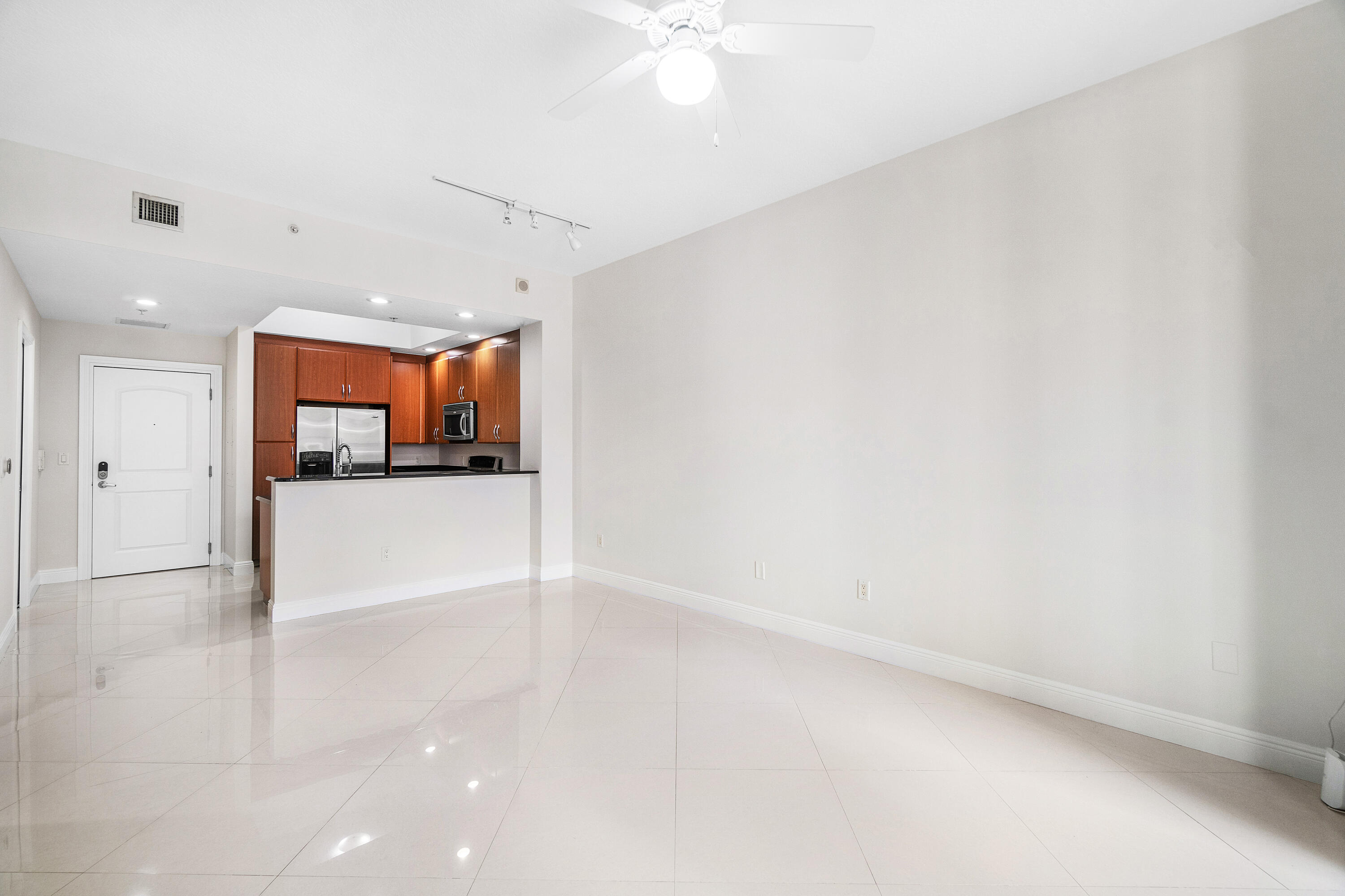 Discover an exceptional opportunity to live in the prestigious Two City Plaza, a premier full-service building perfectly located in the heart of Downtown West Palm Beach. Situated just across from One Flagler and minutes from all of downtown's top destinations, this stunning 1-bedroom, 1.5-bath residence offers a sophisticated urban lifestyle. Boasting soaring 10.5' ceilings and south-facing exposure for natural light, the condo features beautiful modern flooring, freshly painted interiors, updated lighting (not shown in photos), and an open-concept kitchen. Primary Bedroom has new carpeting, large walk-in closet and 2nd closet and fabulous bathroom with dual sinks, separate tub and shower. The private balcony perfect for enjoying the Florida sunshine. 1-garage parking space is included.  This full-service building boasts exceptional amenities; 24-hr security, concierge, roof top pool, hot tub, sauna, steam room, fully renovated state-of-the art fitness center/gym, new outdoor kitchen w/ BBQ area and all new Restoration Hardware furniture, outdoor & indoor movie theaters, club room, table tennis, lanai courtyard w/ water feature, renovated roof top dog park area, complimentary valet parking & exceptional staff. Unbeatable location and perfectly positioned in the heart of Downtown West Palm Beach, Two City Plaza is adjacent to One Flagler and 360 Rosemary office spaces, providing ultimate convenience for professionals. Just 1-block from the bridge to Palm Beach Island, residents enjoy effortless access to Worth Avenue's world-class shopping, award-winning dining, and pristine beaches. Approx. 7-minutes from PBIA airport, ensuring seamless travel. Experience luxury, convenience, and sophistication in one of the most desirable locations in South Florida.