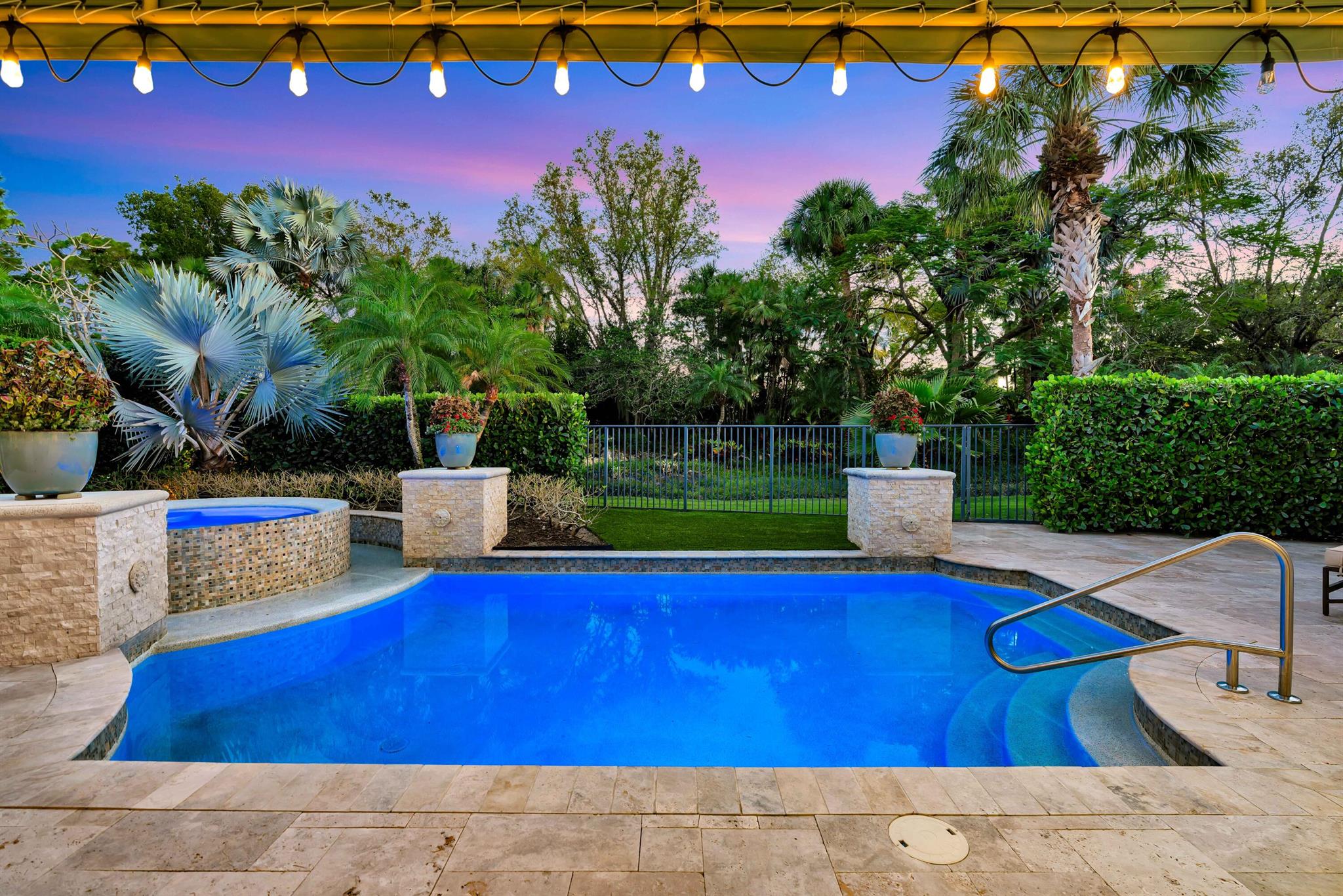 Welcome to 11216 Orange Hibiscus Lane, a meticulously updated and fully furnished residence with a NEW ROOF in the prestigious Old Palm Golf Club. This elegant home offers 4 bedrooms, 4 full bathrooms, and 2 half bathrooms within 3,735 square feet of living space. ￼Upon entering, you're greeted by a spacious great room featuring a newer built bar, ideal for entertaining guests. The open floor plan seamlessly connects the great room to a gourmet kitchen equipped with white cabinetry, quartz countertops, a large island, and newer appliances. Adjacent to the kitchen is a sunny breakfast room, perfect for casual dining. ￼The primary suite is a private retreat, boasting two walk-in closets, dual vanities, a luxurious tub, and a separate shower. A cozy office/den provides a quiet space for work or relaxation, while a long hallway leads to three additional en suite guest bedrooms, ensuring comfort and privacy for all residents. Step outside to the beautifully landscaped patio and pool area, where you can enjoy Florida's year-round sunshine. The property overlooks a decorative water feature maintained by the association, enhancing the serene ambiance. As a resident of Old Palm Golf Club, you'll have access to a new 20,000 square-foot lifestyle center featuring a fitness facility, spa, lap pool, and more. Please note that membership is required to enjoy these exclusive amenities. This exceptional property combines luxury, comfort, and an enviable location, offering a unique opportunity to experience the finest in South Florida living.