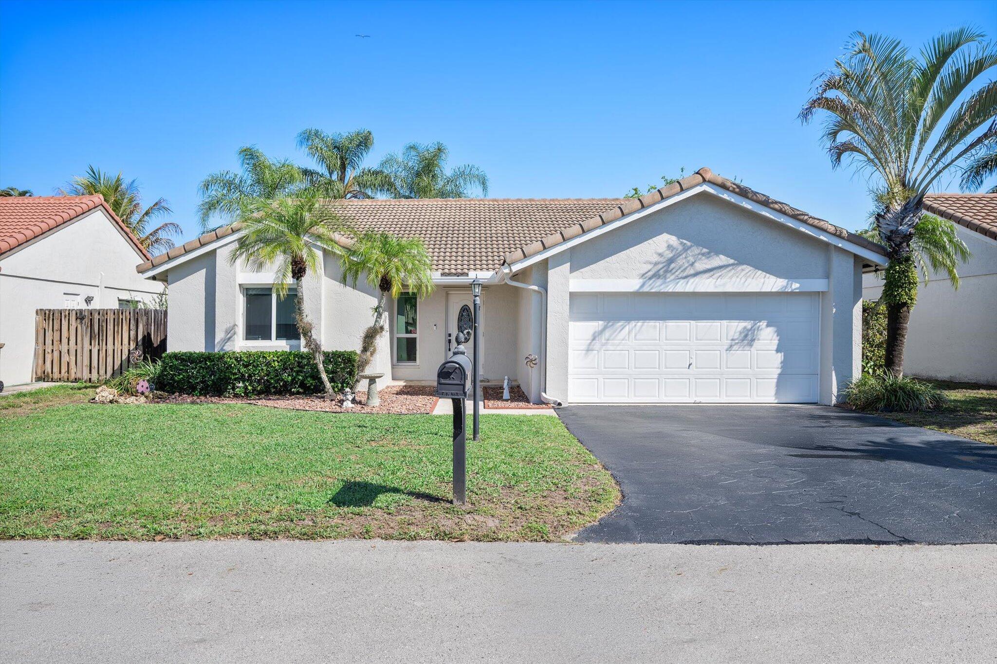 Welcome to the highly sought-after Hawkes Bluff community. This well-maintained home offers 3 bedrooms and 2 full bathrooms, featuring FULLY IMPACTED WINDOWS THROUGHOUT, NEW AC, NEW WATER HEATER, updated electric panel, tile flooring throughout the main living areas and attractive wood-look flooring in the bedrooms. UPDATED KITCHEN with ample counter space, a tile backsplash, and panty. REMODELD BATHROOMS!  The centrally located dining area provides seamless access to the spacious screened lanai and fully fenced backyard, perfect for indoor-outdoor living. A 2019 screened enclosure, hurricane-rated and a beautifully added travertine patio enhance the outdoor space! A+ SCHOOLS NEARBY!