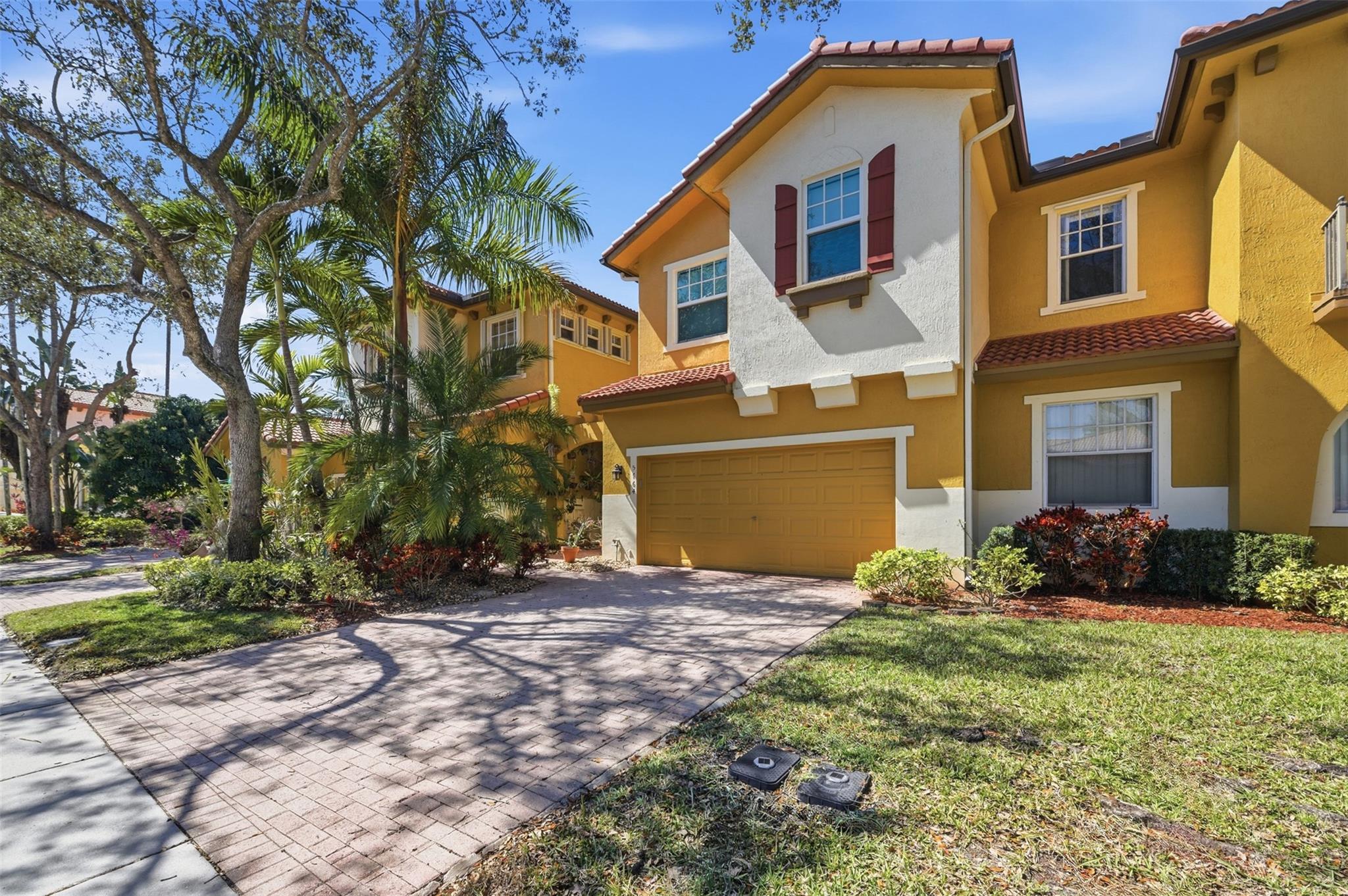 Beautifully upgraded 3 bed/2.5 bath town home w/ 2,265 sqft of living area! New roof (2024) & Impact windows/doors make for great year round use or as a vacation home, no need to stress about shutters. 2 story volume ceiling on entry & large tile throughout separate formal & living rooms make for an inviting living area. Well appointed kitchen w/ granite tops, newer appliances & pantry. Upgraded wood floors on second floor. Garden views from the primary bedroom w/ 2 walk in closets & fully renovated primary bathroom w/ double shower heads & full glass shower. Oversized 2 car garage. Parking for 6. Master planned community featuring resort style living: 2 large clubhouses, multiple pools, fitness center, tennis/pickle ball, basketball, kids splash pad, sauna, etc. A rated Parkland schools.