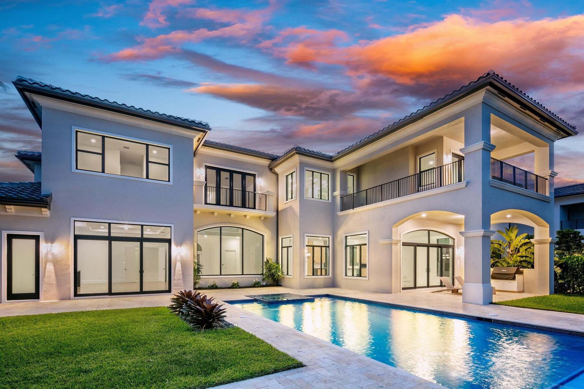 EXTRAORDINARY VALUE: Exquisite palazzo estate in Boca Bridges is now available. This customized lakefront masterpiece offers spectacular design and lifestyle with great amenities and security in a prestigious Boca Raton neighborhood. With a total of 9,769 SF, luxury living is elevated in this 6 bedroom, 7.1 bath home with tranquil lake views. This impressive two-story home permeates with themes of clean lines, sophisticated design and stunning finishes. Each curated space is masterfully designed for luxurious living and gracious entertaining. In addition to 6 ensuite bedrooms, the property features a great room, a gourmet open kitchen with family room, formal dining room, media room, club room with a bar, study/loft, an elevator and 4 car garage.An attractive entrance gives way to a spacious great room with soaring ceilings and dramatic windows that allow abundant natural light to flow through. Highlights include a family room that opens directly to the covered patio and its built-in summer kitchen with an open gourmet kitchen that features high-end appliances, custom-crafted light wood cabinetry and two elongated islands.

Second floor highlights include an elegant and spacious owner's suite with its own covered balcony, two huge walk-in closets and a sprawling owners' bath.

With beautifully landscaped grounds, the property also features a verdant backyard with an oversized pool and a jacuzzi.

The concept of resort-style living is elevated and celebrated amid a west Boca Raton community brimming with world-class amenities and luxury estates. Beyond their own backyard, residents of Boca Bridges have access to a myriad of amenities befitting such a dynamic development. The centerpiece of activity is a 27,000-square-foot clubhouse where neighbors can socialize and enjoy the good life as well as gourmet meals inside the community's own restaurant. For active residents, Boca Bridges boasts a fitness studio with cardio and strength-training equipment, yoga classes, an indoor basketball court, six clay (and one asphalt) tennis courts, and four pickleball courts. There's even a splash water park for kids adjacent to the main pool (which features an outdoor bar area).