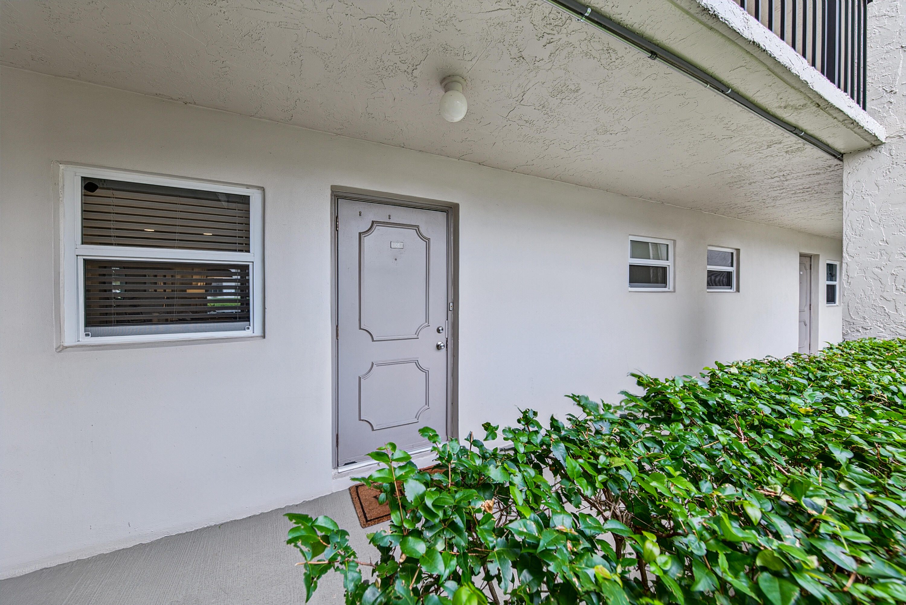 Gorgeous renovated 1 bed/1 bath unit  complete with full hurricane impact glass. It is on the first floor for your convenience. It has beautiful lake views from the patio which is screened in so you can enjoy the Florida weather. This unit has completely updated flooring, open floor plan with updated kitchen and bath, new electrical (panel,switches,outlets).Newer stainless appliances and AC unit as well as all new doors throughout the interior. Built ins in primary walk in closet  and pantry. Seller open to possibility of leaving all of the furnishings making this a perfect tropical second home or home for a college student or a couple. The community offers resort/country club style amenities including golf, pickle ball, tennis, gym, sauna, restaurants and more. see rules and regs, condo docs, sellers disclosure,flood disclosure, assoc application, budget, condo disc, etc in attachments