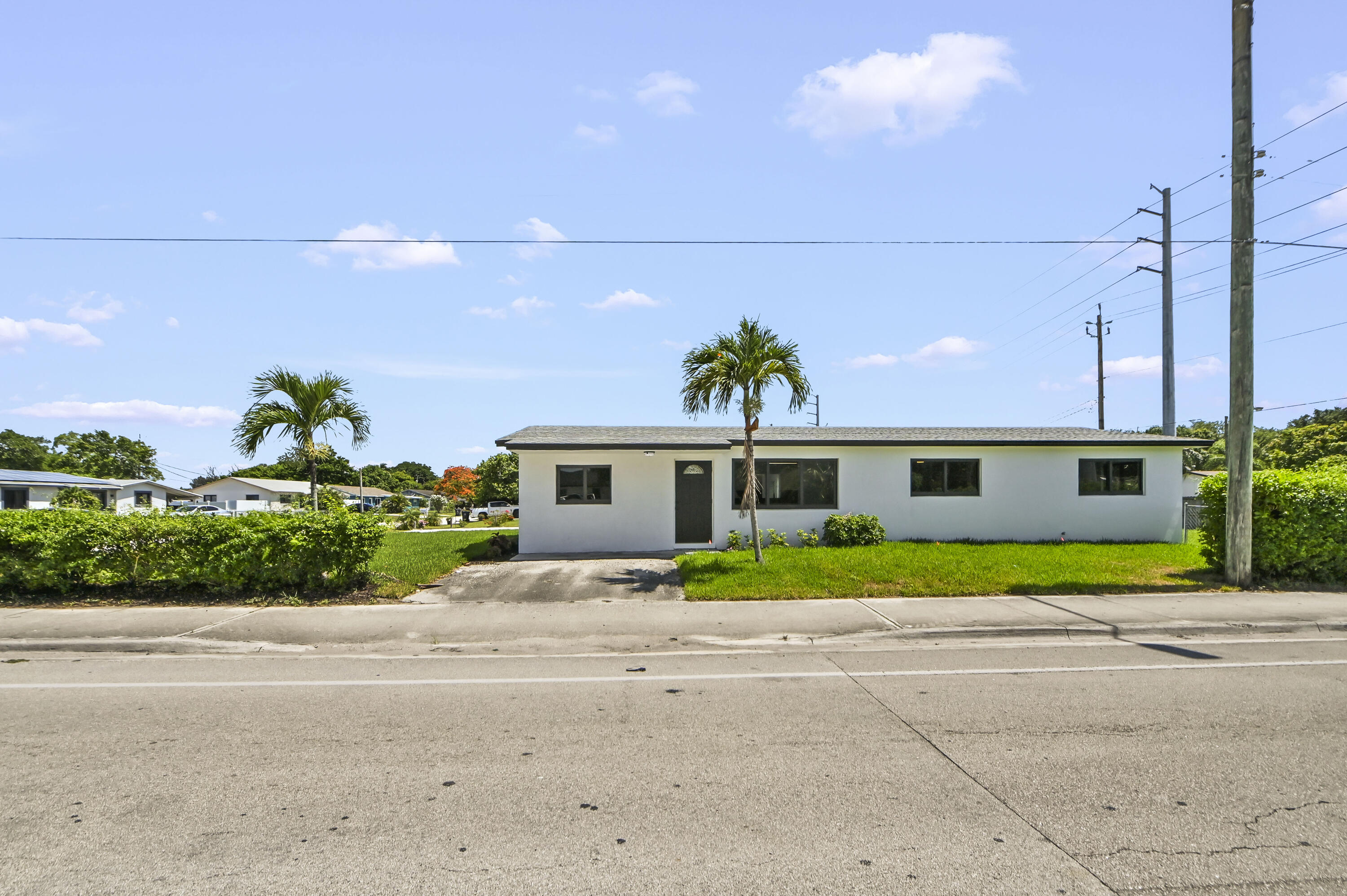 Completely Renovated 4-Bedroom (or 5th Bedroom/Office) Home on a Beautiful Corner Lot - Move-In Ready! Welcome to this beautifully updated single-family home at 3645 Melaleuca Ln in Lake Worth, FL. Extensively renovated and completed in June 2026, this charming residence offers 1,839 square feet of modern living space featuring 4 bedrooms, 2 full bathrooms, and a flexible 5th bedroom or home office. Inside, you'll find a fresh open-concept design with new flooring throughout, a fully renovated kitchen with brand new cabinets, countertops, and stainless steel appliances, and completely updated bathrooms with new fixtures. The entire interior and exterior have been freshly painted, and storm-rated windows and doors have been installed for safety and efficiency. Major systems and exterior upgrades include:     •    New Roof (March 2022)     •    New Electrical Meter & Panel (January 2025)     •    New Septic System (April 2023)     •    New HVAC System     •    New Paver Driveway     •    Brand New Sprinkler/Irrigation System     •    All New Grass and Professional Landscaping This home sits on a lovely corner lot with excellent curb appeal and beautiful landscaping. Just minutes from the beach (approximately 3 miles), shopping, dining, and major roadways, it offers the perfect Florida lifestyle location. Meticulously maintained and upgraded with no expense spared, this turn-key property is ready for immediate move-in. Whether you're looking for a primary residence, vacation home, or investment property, this one checks every box. Don't wait — schedule your private showing!