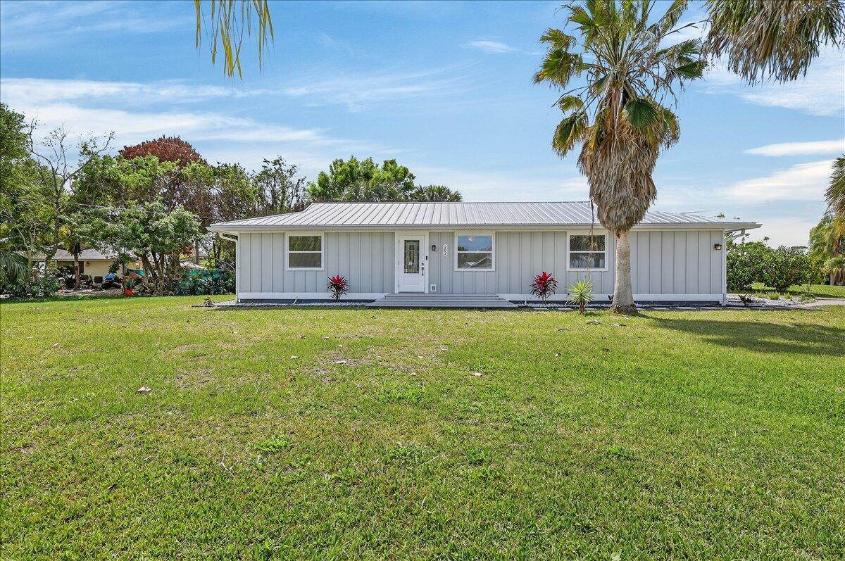 Welcome to this charming 3 bedroom/2 bathroom home with an open, split-floor plan and stunning, updated interior situated on a large 0.29 acre lot! Brand new luxury vinyl flooring throughout the home. HUGE updated kitchen with a built-in oven, electric cooktop, peninsula island with barstool seating, and PLENTY of cabinet/counter space. The spacious master bedroom features a walk-in closet with built-in shelving and an ensuite with a gorgeous walk-in shower with a rainfall showerhead. 2021 METAL Roof!! Great location- less than 10 minutes from shopping, restaurants, parks, and schools, and less than 20 minutes from breathtaking east-coast beaches. Easy to see, schedule a showing now!