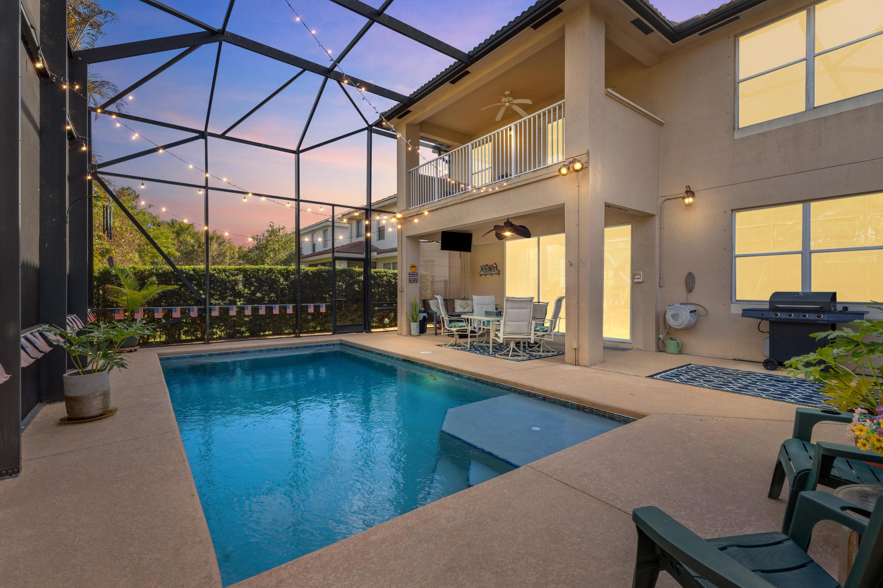 Rarely available Laguna model in the prestigious Oaks of Hobe Sound. This pool home offers an expansive open-concept layout ideal for entertaining. The oversized kitchen features 42" wood cabinetry, stainless steel appliances, granite countertops, and a large walk-in pantry. It flows into the dining area and family room. A powder bath and laundry room are located on the first floor. Outdoors, a private pool is framed by an extra-tall screened enclosure for year-round enjoyment. All bedrooms are upstairs, along with an oversized loft ideal for a media room, game room, or additional living space. The primary suite includes dual vanities, a recently updated walk-in shower, soaking tub, and large his-and-hers closets. New A/C in 2025. Minutes from beaches and in a A-rated school district.
