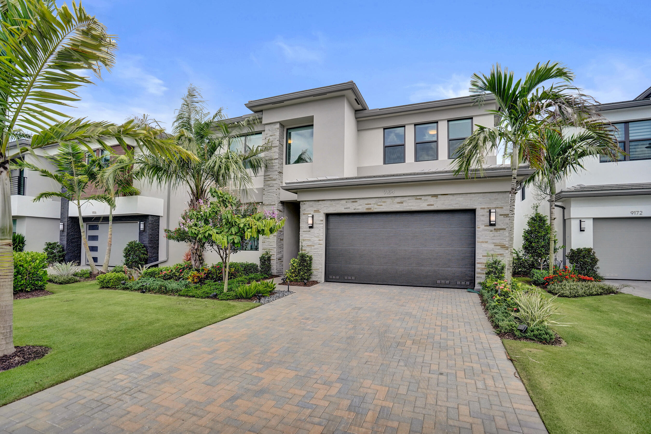 Welcome to 9164 Silver Marsh Lane, a beautifully appointed two-story residence located in Boca Raton's gated Lotus Edge community. Offering 4 bedrooms, 4.5 bathrooms, and approximately 3,282 square feet of living space, this home features a spacious, functional layout designed for both comfort and everyday living. Highlights include an inviting eat-in kitchen with a center island, a formal dining area, generously sized bedrooms, walk-in closets, an entry-level bedroom, garden views, an open patio, and a two-car garage. Residents also enjoy access to exceptional resort-style amenities, including a clubhouse, fitness center, café, heated pool, spa, tennis courts, jogging paths, playground, and gated security.