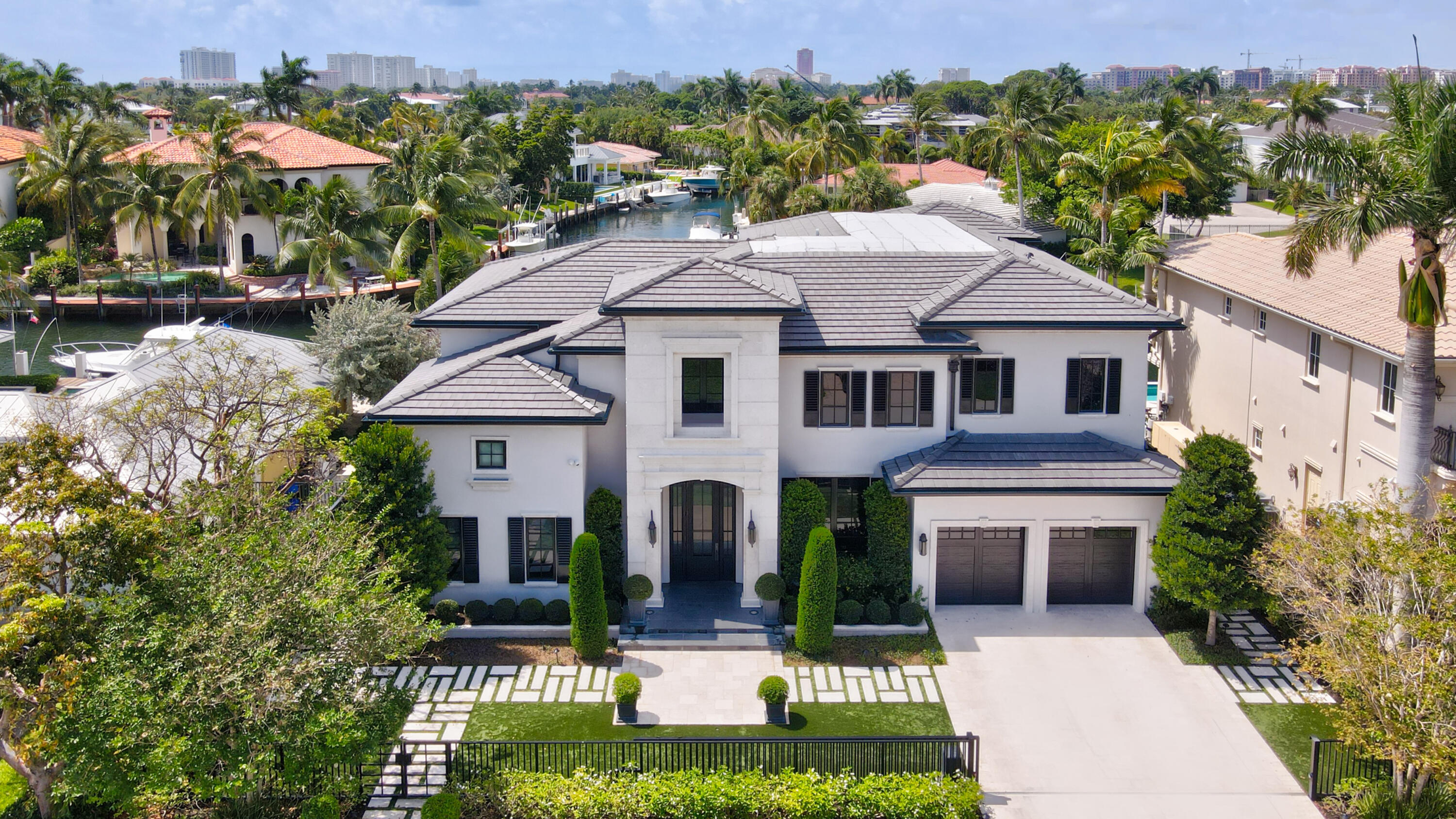 Located on one of the most sought-after streets & communities in East Boca Raton, this spectacularly custom crafted contemporary waterfront estate exudes quality and refinement. This prime lot situated on 85 feet of deep water with a brand new raised dock and seawall, is the perfect retreat for the avid boater with no fixed bridges and only minutes away from the ocean. A complete rebuild transformed this two story estate into a stunner, boasting exceptional indoor-outdoor living, with no attribute left untouched. Step into the grand foyer featuring soaring ceilings and opening to an exceptional floor plan. Sleek craftsmanship, unparalleled quality, and a unique mix of bespoke and warm finishes throughout the entire home makes this estate fit for the most discerning occupant. 
See 'More'.. This estate showcases stunning east, southeast, and west waterway views. Boat dockage is 70 feet, perfect for a 65 foot yacht. The great room & designer gourmet chef's kitchen featuring top-of-the-line appliances along with butler's pantry, is the perfect place to entertain with a gorgeous Cristallo Quartzite Island/Bar in the center. Large floor-to-ceiling glass windows/doors seamlessly extend outside to the covered loggia and lounging area, outside marble deck with a pool and spa, summer kitchen, fireplace, & pristine water views. The main level presents a gracious custom designed office overlooking the water, and a custom commercial grade wine cellar with an eSommelier System. A first floor bedroom with ensuite bathroom and walk-in closet is the perfect guest room or in-law suite. Upstairs the Master Suite is a true private oasis that includes a covered balcony with beautiful Intracoastal views, a sitting room, a glamorous master bathroom with soaking tub and rain shower heads, and two extravagant walk-in closets/wardrobes. The estate features two laundry areas, one on each level. A bonus room with soundproof flooring on the second level is the perfect place for a gym or yoga/meditation studio. This is waterfront living at its absolute finest with meticulous attention to design and detail. Offered unfurnished, with furniture negotiable.

Golden Harbour is first class living at its best in East Boca Raton within walking or biking distance to Mizner Park, downtown Boca Raton boutiques/shops and restaurants, The Boca Raton Club, the ocean, and a few minutes drive in your car or golf cart from the Boca Inlet and Lake Boca.

DETAILS:
New Construction - Re-build 2019/2020
Architect: Stephen J. Urbanek
Interior Design: Sketch, A Design Studio
Builder: Keystone Construction 
Sq footage: 5498
Total Sq footage: 7152
Waterfront: 85 feet
Dock: 70 feet
4 Bedrooms
4.1 Baths

Upgrades/Features:

Systems:
Whole House Generac Generator with no load shedding
3 Tankless Hot water Heaters with Recirculating Pumps
3 Zone AC with HEPA Filters
Security cameras in entire perimeter & dock
Speakers in every room & exterior patio
Whole house Sonos System
Rain Bird Sprinkler/Irrigation System
SWAT Mosquito System
Pool Heater - Gas
Aqualink App for Pool

Exterior  Front Yard:
New Roof with Concrete Shingles (2019)
Mature Landscaping
Gas Lanterns
Gated front yard & driveway
Marble driveway and pavers  mud set on a slab
Artificial Turf irrigated for easy cleaning
Custom limestone façade on entry way
Custom Iron front door with operable center panel

Exterior  Back Yard:
Marble Pavers, steps & planters with ledges for seating
Select Grade Cypress ceilings on covered areas
Fire bowls
Fireplace/Fire Pit
Marble gutters along 2nd floor balcony
Increased dock height
All new pilings (2019)
Summer Kitchen with 36" Alfresco Grill
Pool/Spa - Salt Water - 6 feet depth
Outdoor shower
Multiple Decks

Interior 1st floor:
Bangalore Ragged Granite floors throughout 
Plaster Crown Molding throughout
Custom wood staircase with 2 story wainscoting
Custom Wainscoting on Entryways throughout
Smart Toto Toilet in Powder bath
Custom Walk in Wine Cellar with eSommelier System and Wine Guardian System (Commercial Grade)
Chef's kitchen
60" Bluestar Gas Range with dual full-size ovens & Griddle
Custom 78" W 1500 CFM Bluestar Vent Hood
Fully integrated 36" Dacor Ref & Freezer
Fully Integrated Miele Dishwasher
60" Galley Workstation sinks with dual faucets
Butler's Pantry with second Fully Integrated Miele Dishwasher
Fully Integrated Subzero Ref Drawers
Miele Steam Oven
Stacked Electrolux Washer & Dryer
Fireplace
Climate controlled garage with dedicated Mini-split Unit
Custom Cabinetry in Garage with Quartz Countertops

Interior 2nd Floor:
Engineered Oak Floors (except Guest Bathrooms & Laundry)
Custom Multi-Tier Chandelier
Master Suite with Morning Bar with U-Line Panel Beverage center
Sitting Room off Master Bedroom
Secondary Laundry Room with Top Load Whirlpool Washer & dryer
Custom Metal & Frosted Glass Barn Doors
His & Hers Custom wardrobes
Cristallto Quartzite Tub Platform
Cristallo Quartzite on all surfaces of Master Shower
Dual Shower heads, body sprays, handheld & Rain Heads.